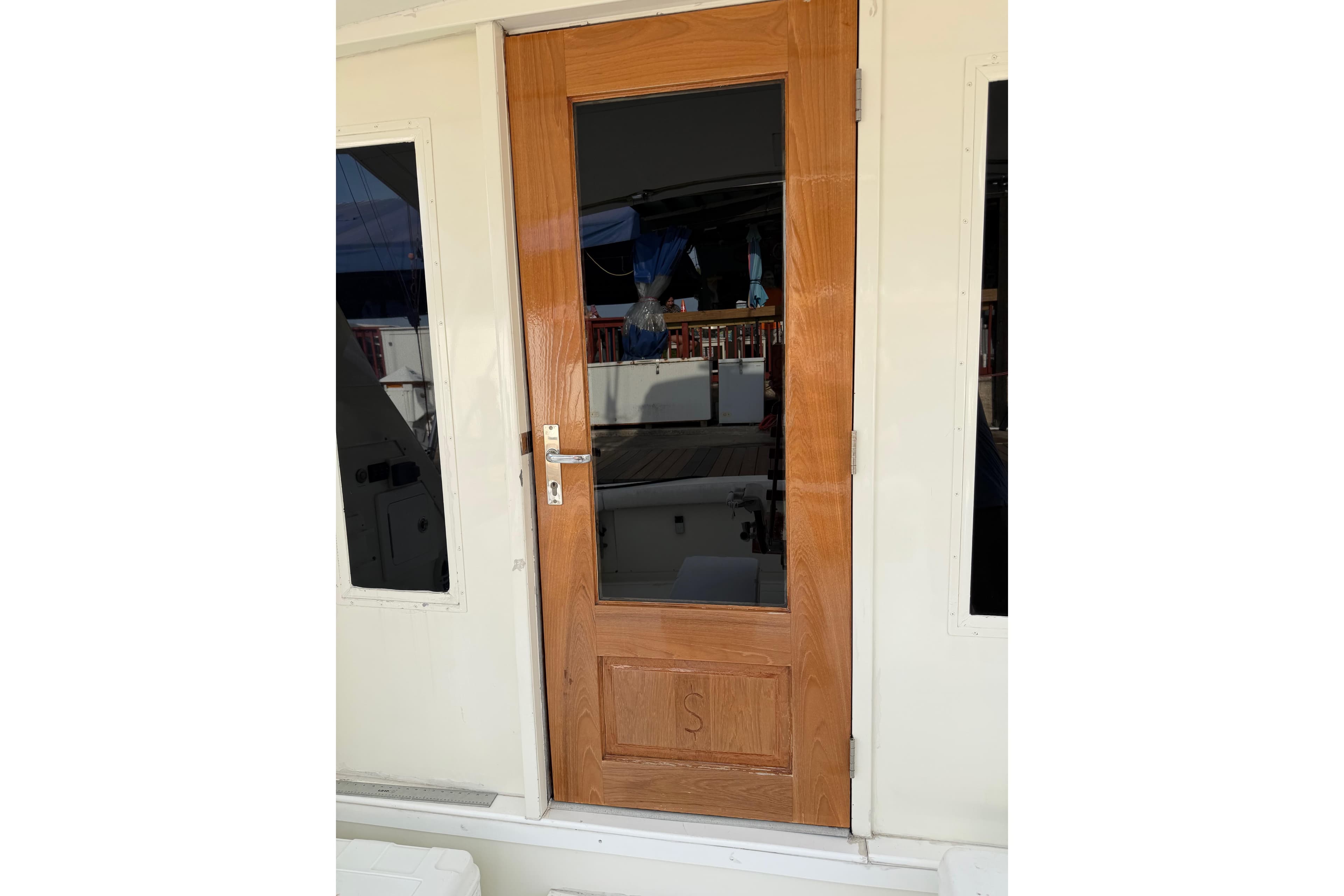 1984 Bertram 42 Convertible yacht wooden door with glass panel.