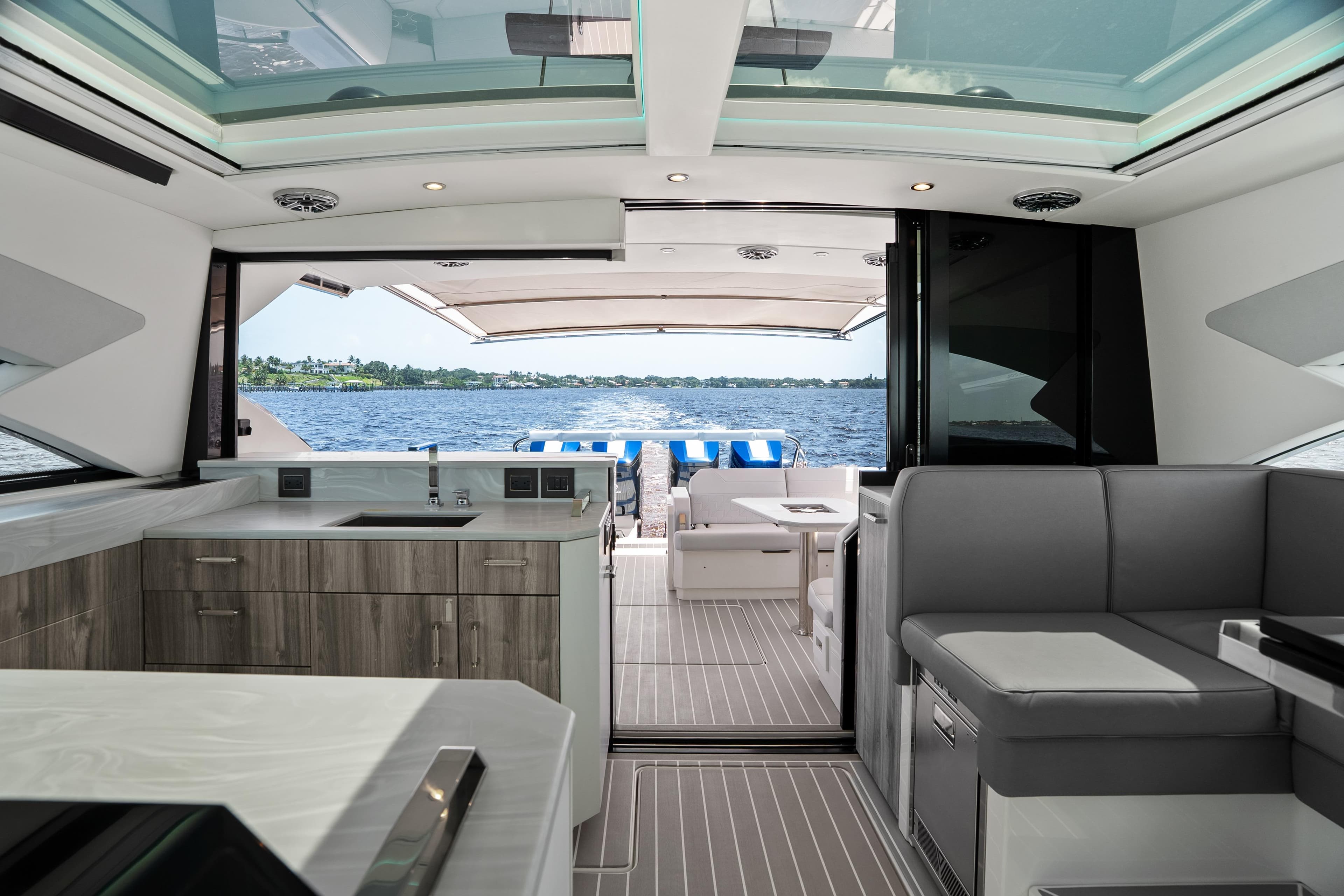 Luxurious interior of 2024 Formula 500 Super Sport Crossover yacht with modern kitchen and seating.