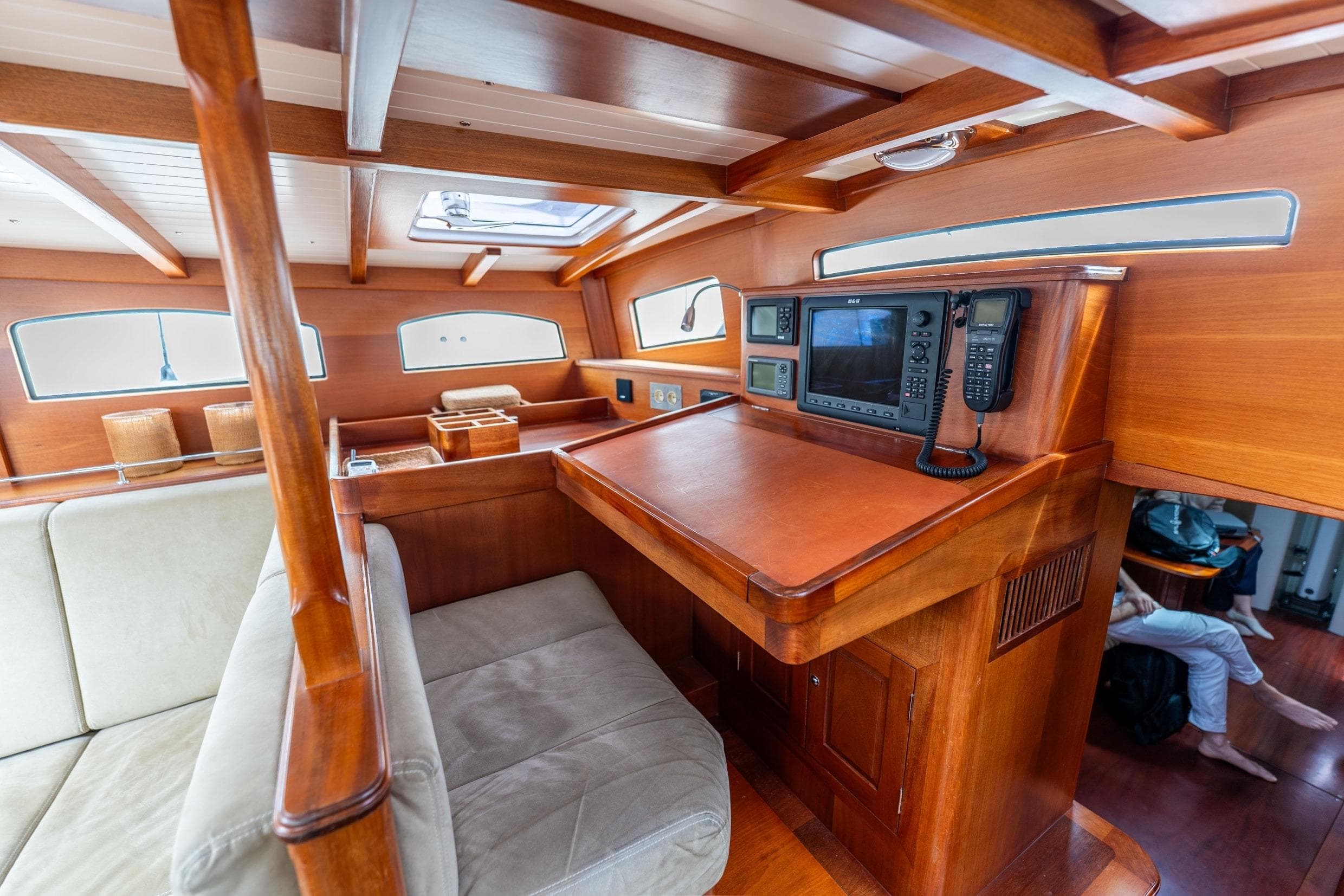 Luxurious interior of 2012 Spirit Yachts 60DH, featuring elegant wood finishes and navigation equipment.