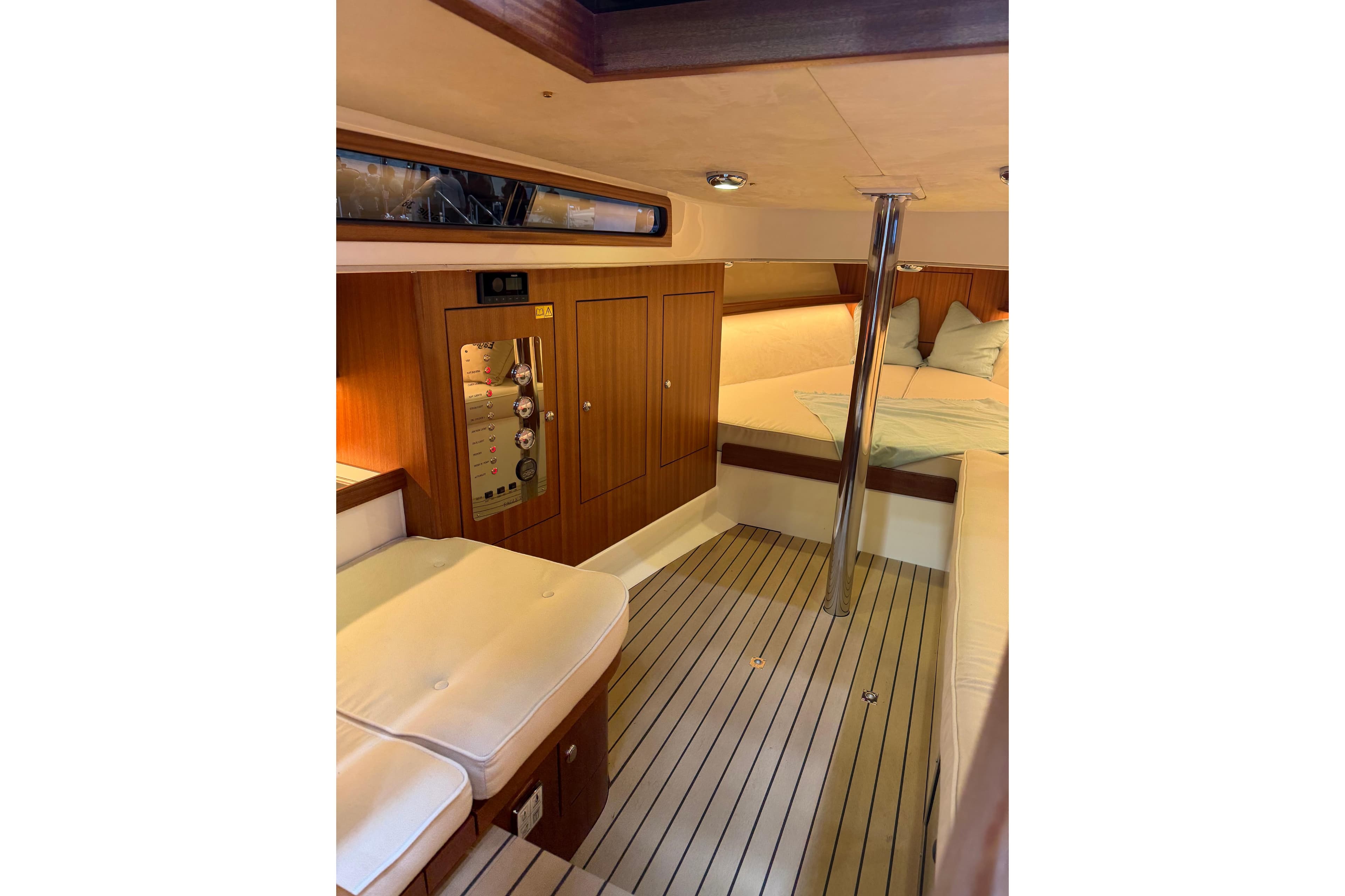 Interior of 2026 Leonardo Yachts Eagle 38, featuring wood paneling and cozy seating.