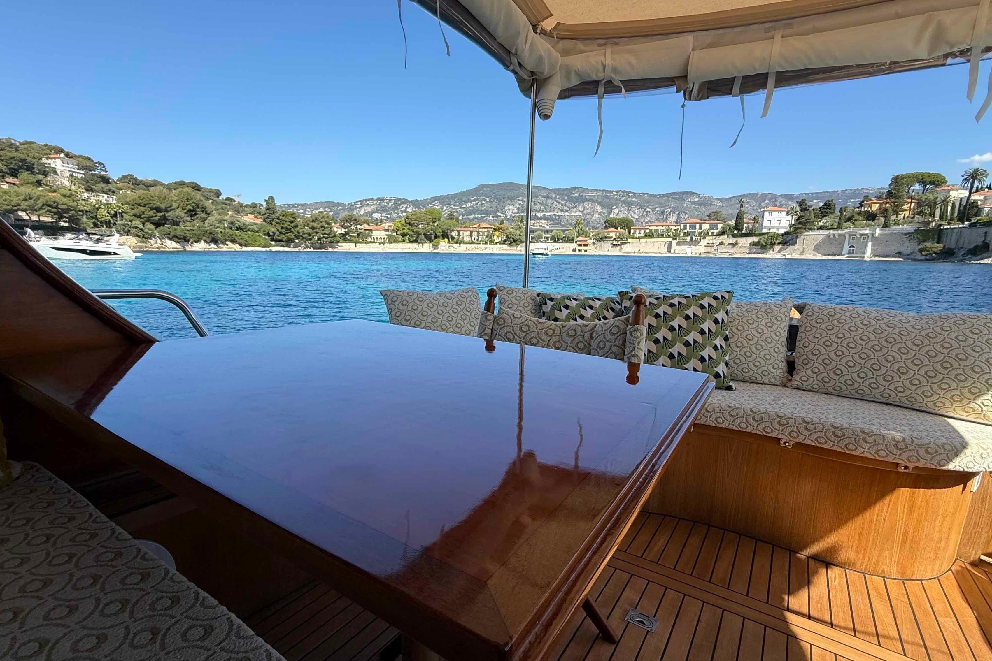 Luxurious 2009 Bani 11,50 Prestige yacht interior with scenic coastal view.
