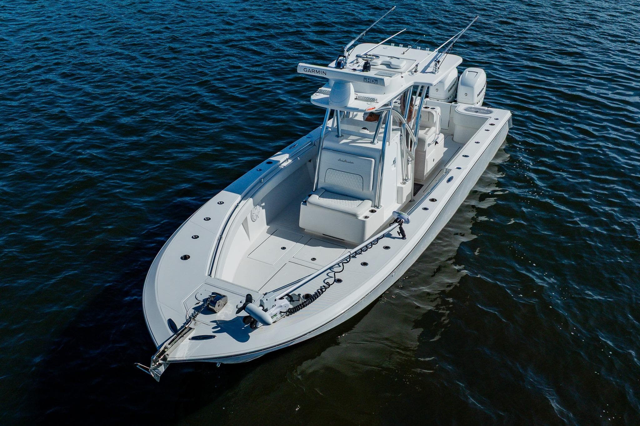 2020 SeaHunter 31 Tournament boat on calm water, showcasing sleek design and fishing features.