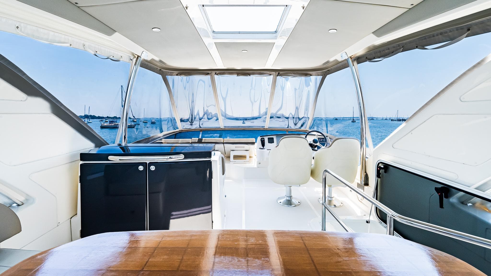 Luxurious 2017 Absolute 50 Fly yacht interior with ocean view and modern seating.
