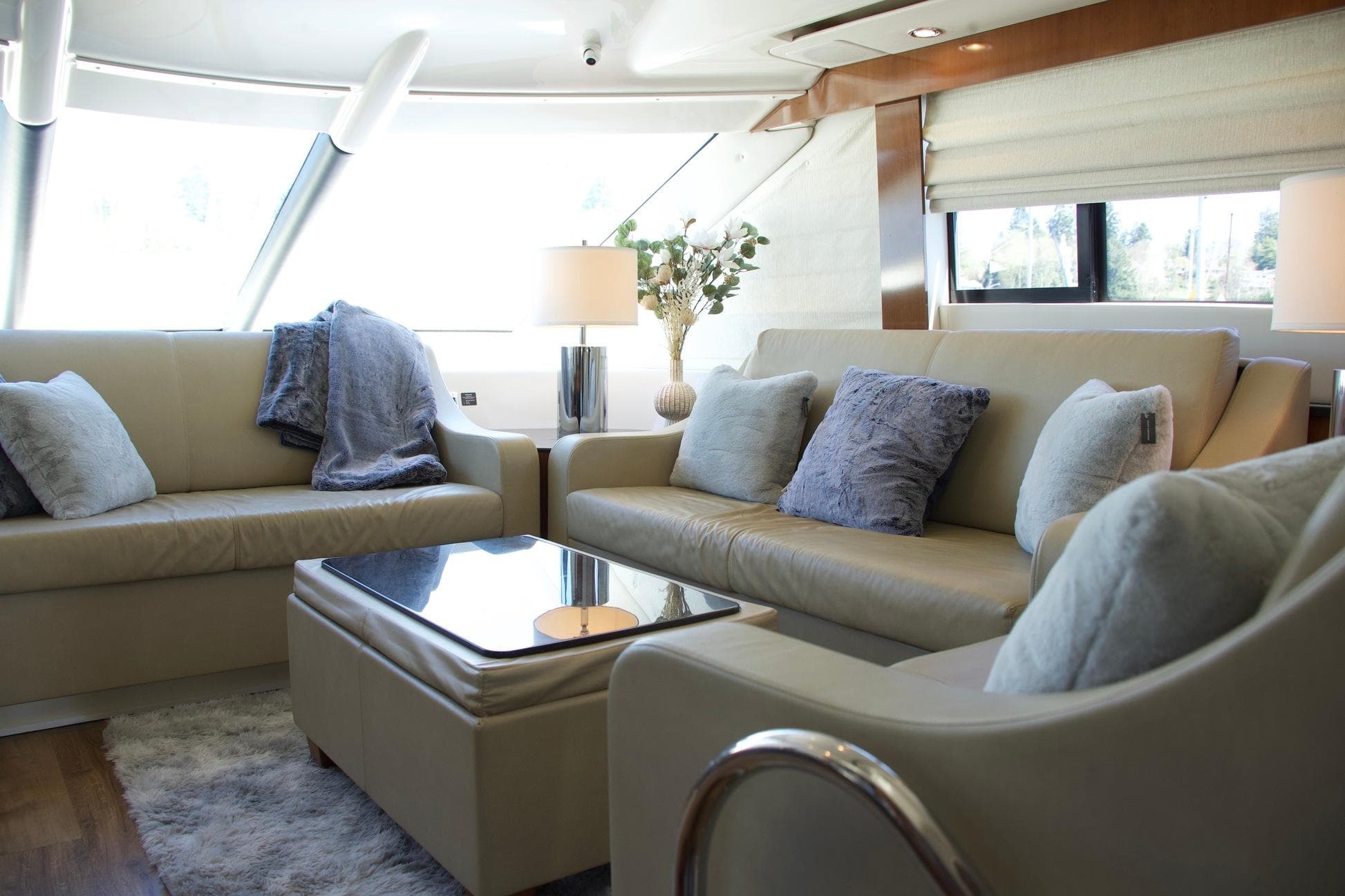 Luxurious interior of a 2012 Meridian 541 Sedan yacht with plush seating and elegant decor.