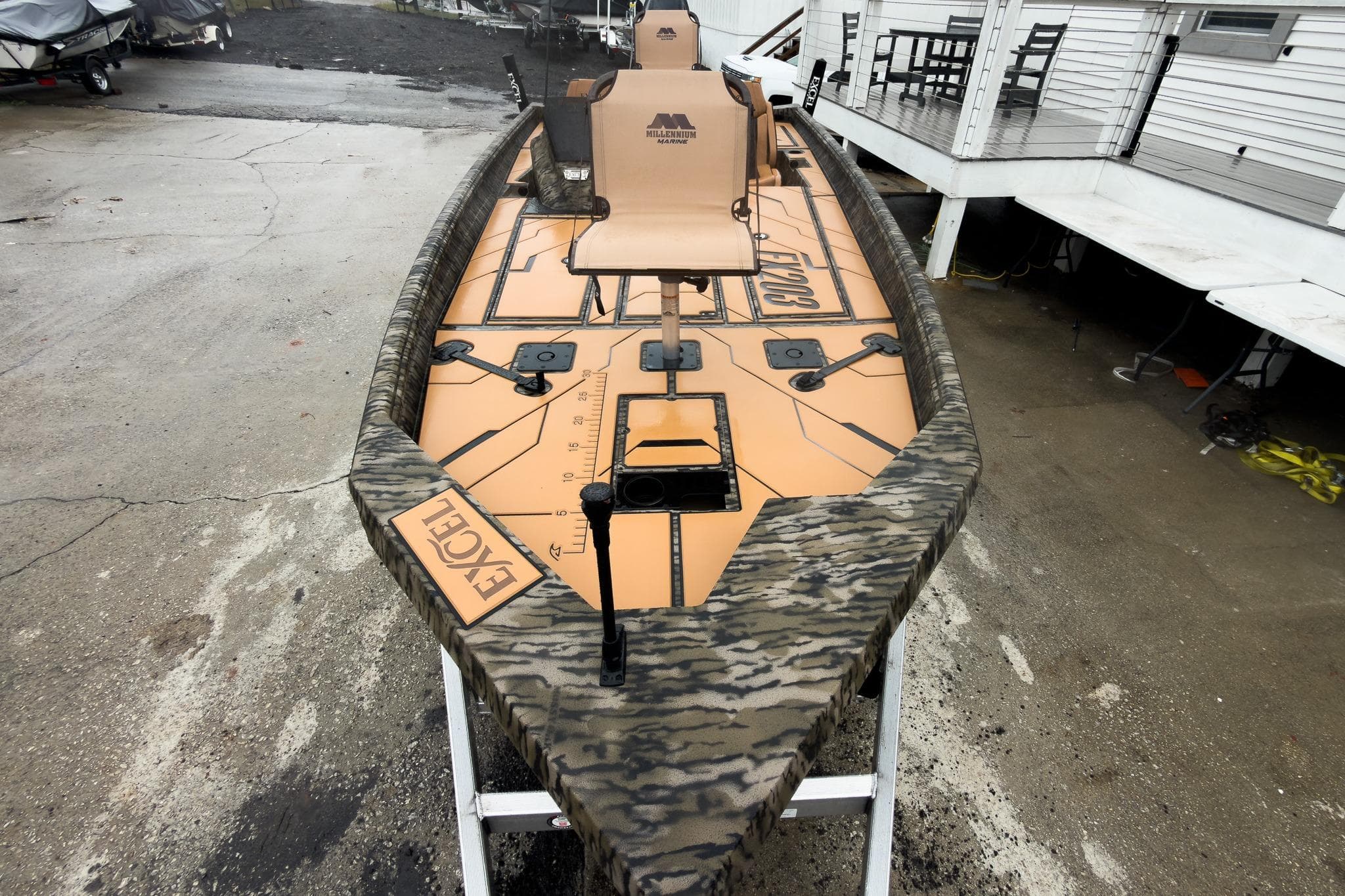 2026 Excel EX203C Crappie & Bass boat with camo design on a trailer.
