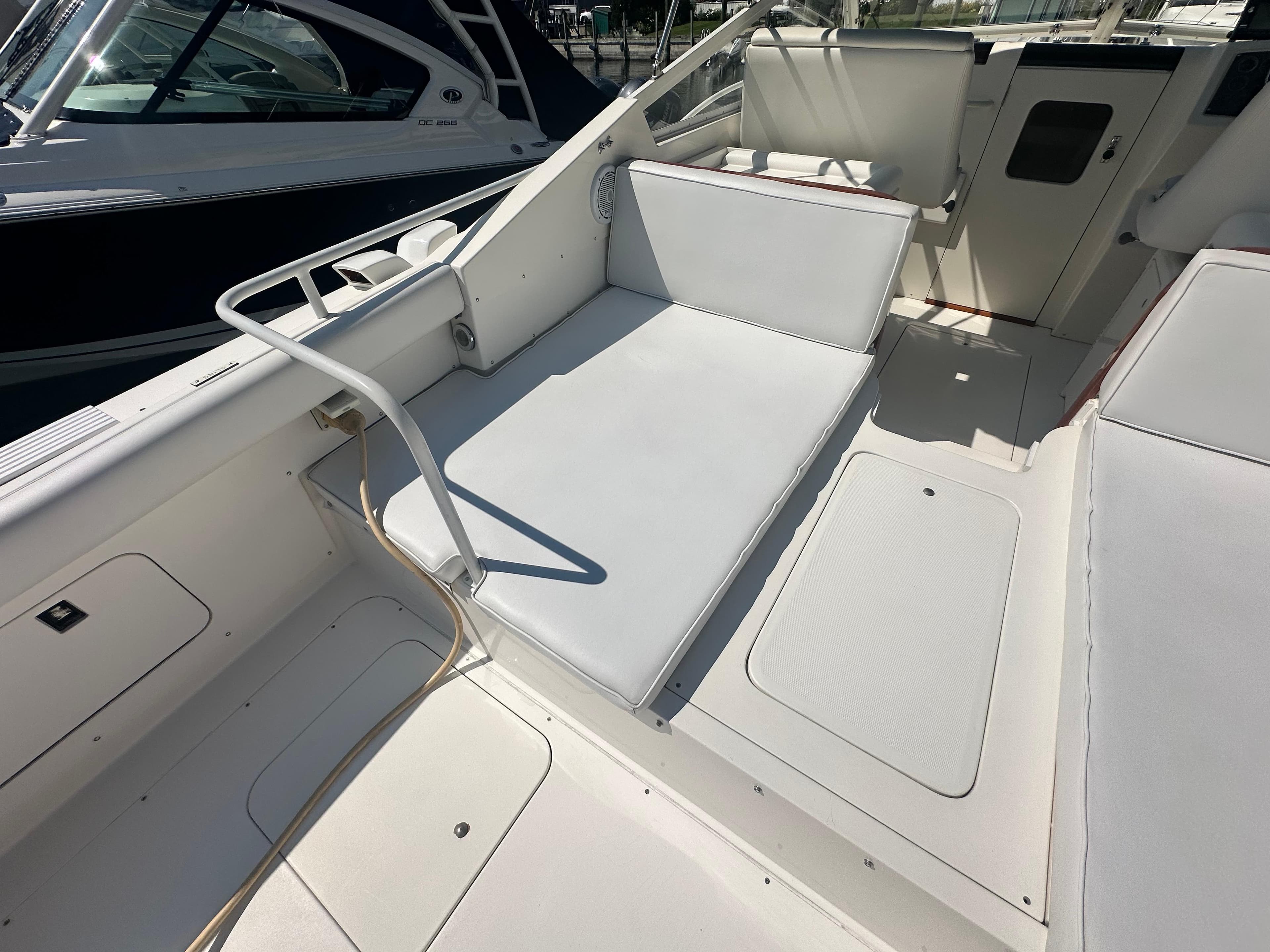 1988 Bertram 28 Moppie boat interior with white seating and deck.