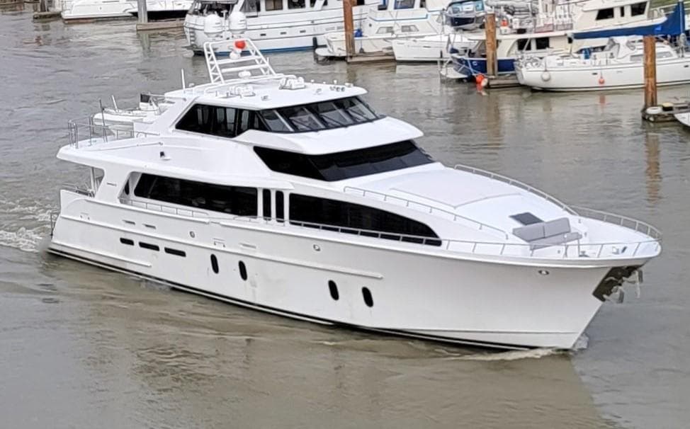 2006 Cheoy Lee Motor Yacht Bravo Series cruising in a marina.