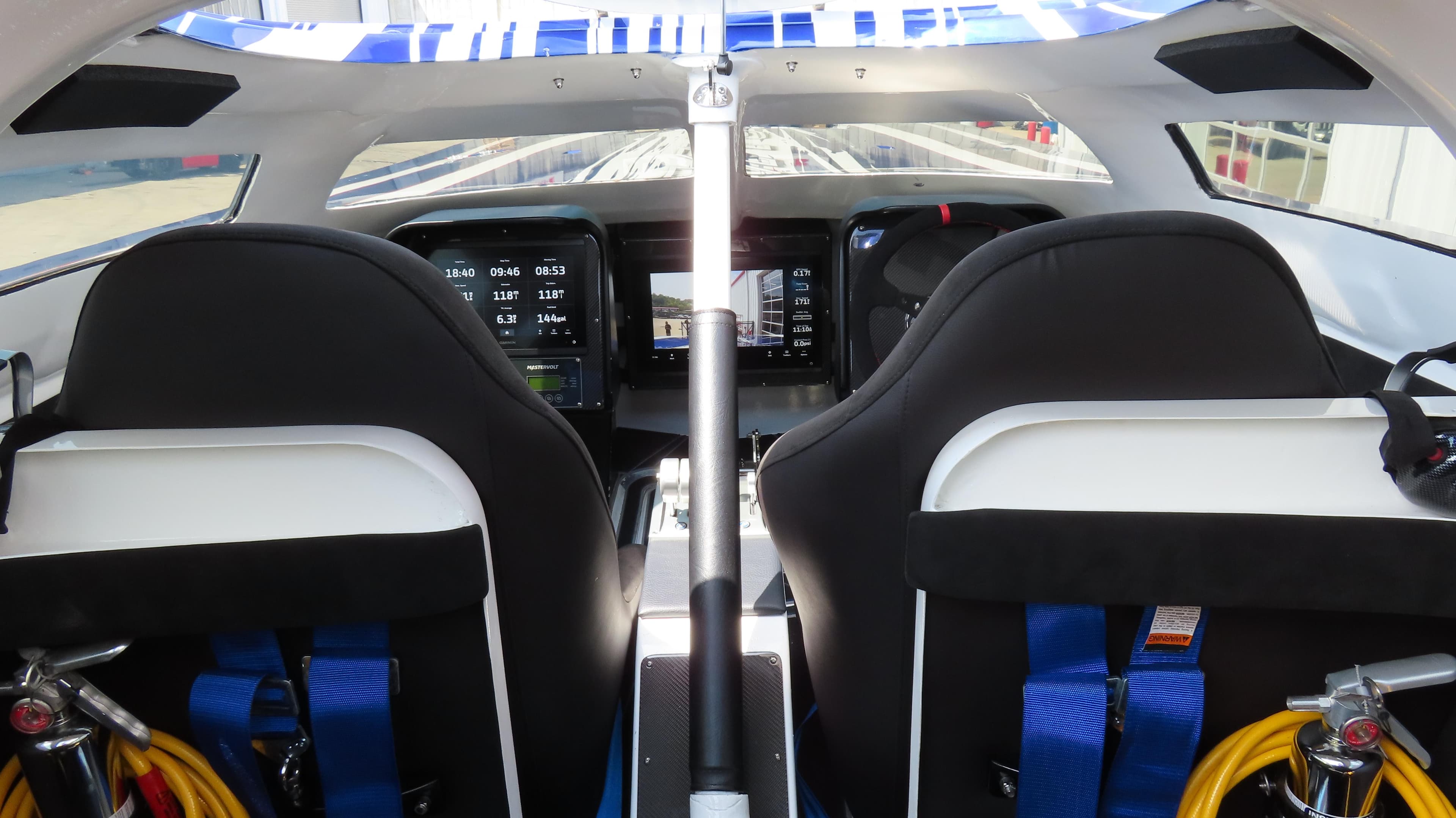 Interior cockpit of a 2007 Mystic Powerboats 50' with dual seats and control panels.