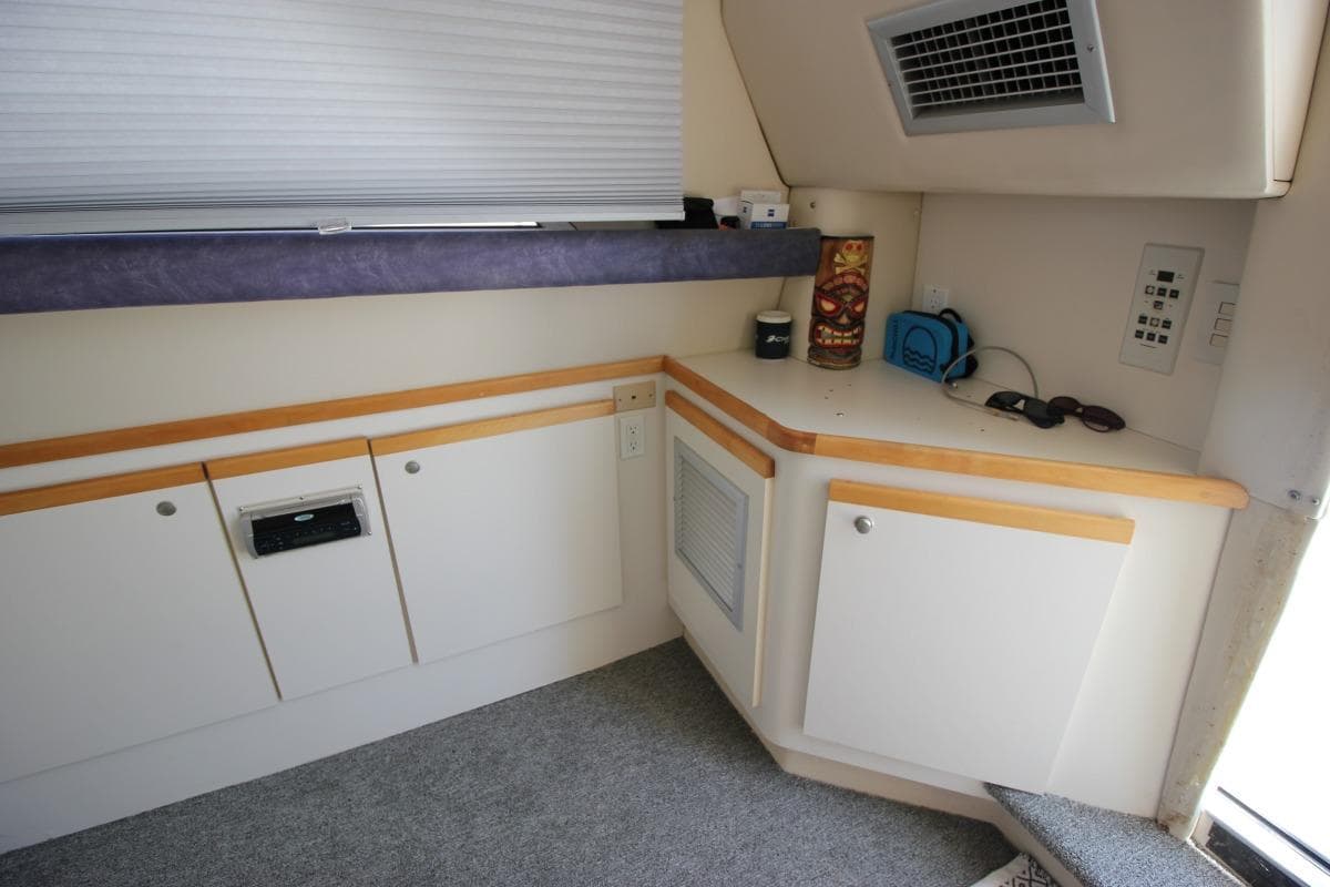 Interior of 1996 Cruisers Yachts 3580 Flybridge with cabinets and modern amenities.