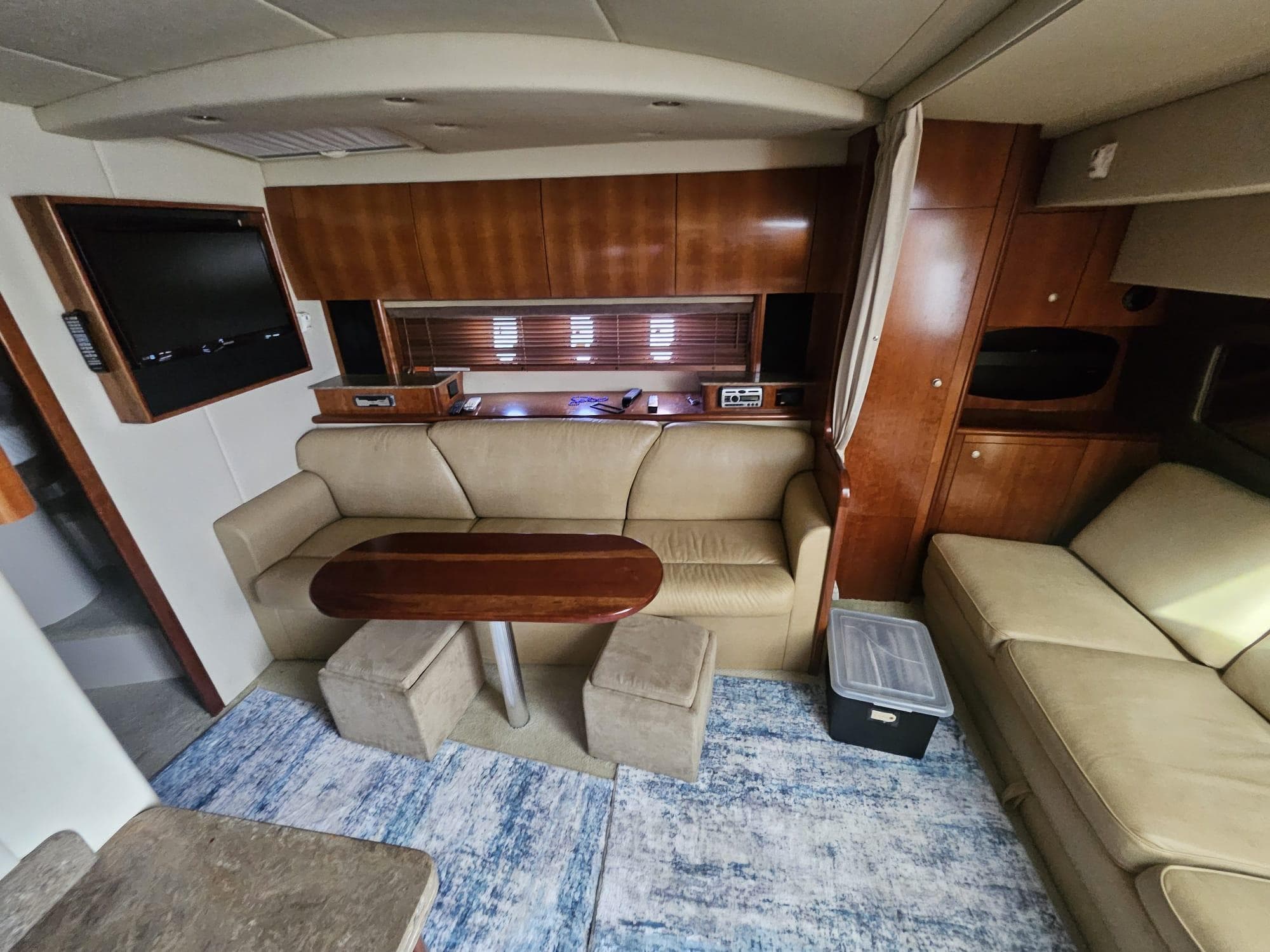 Interior of 2008 Cruisers Yachts 390 Sports Coupe with leather seating and wooden accents.