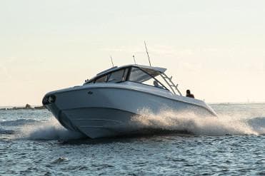 Manufacturer Provided Image: 2019 Everglades 340 Dual Console boat cruising on open water.