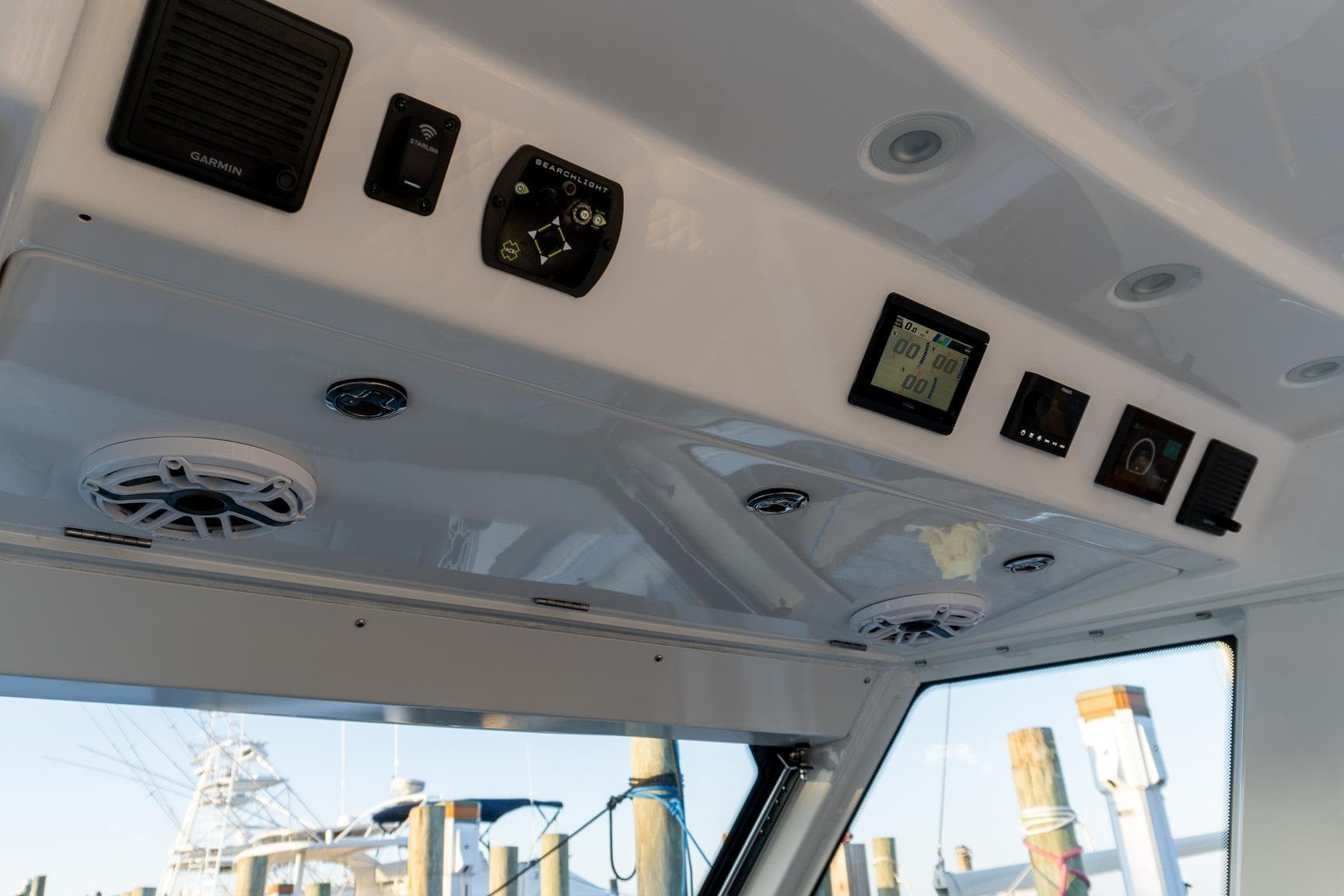 2024 Everglades 395 Center Console dashboard with electronic controls and speakers.