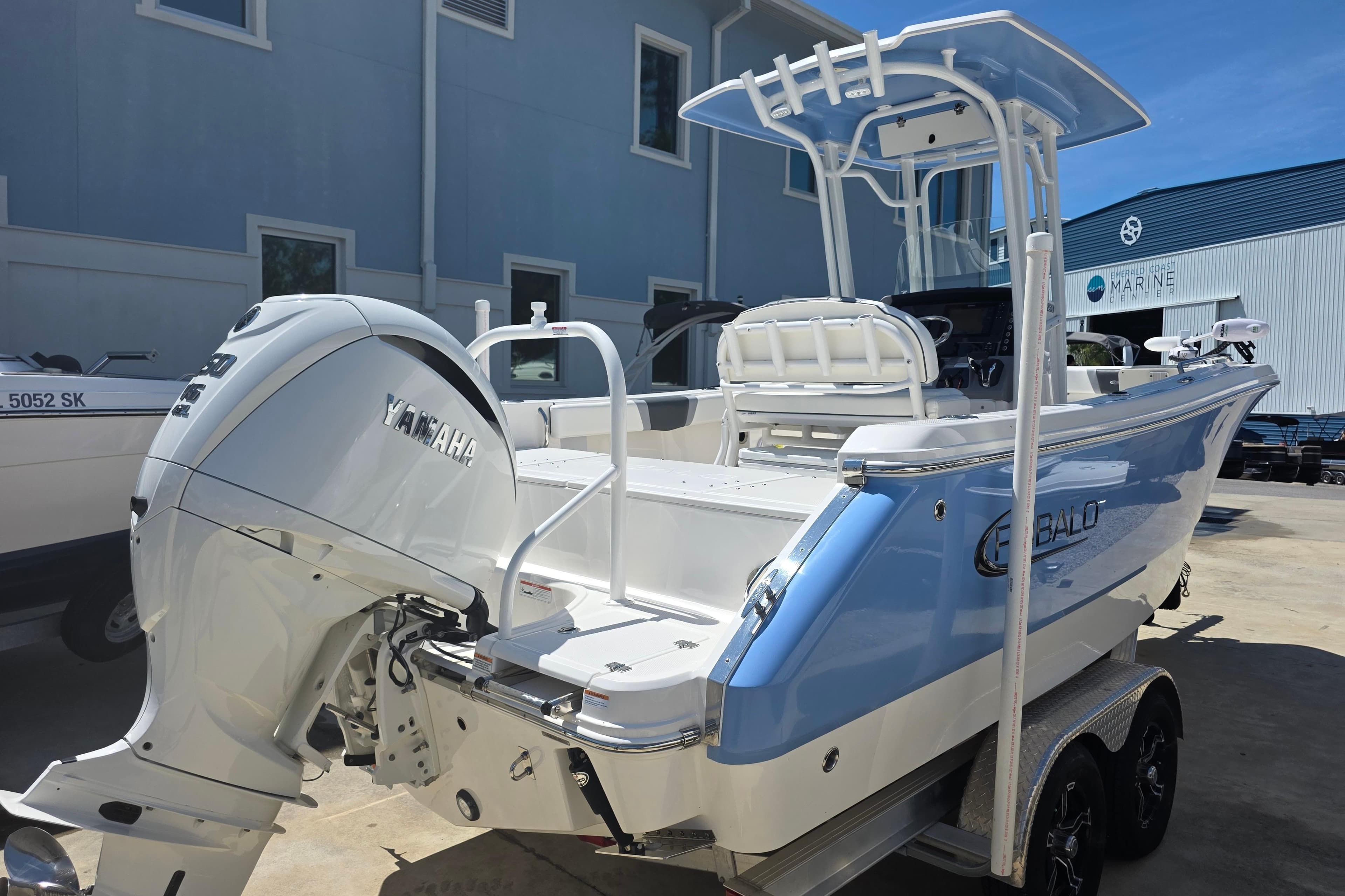 2022 Robalo R230 Center Console boat with Yamaha engine, parked outdoors.