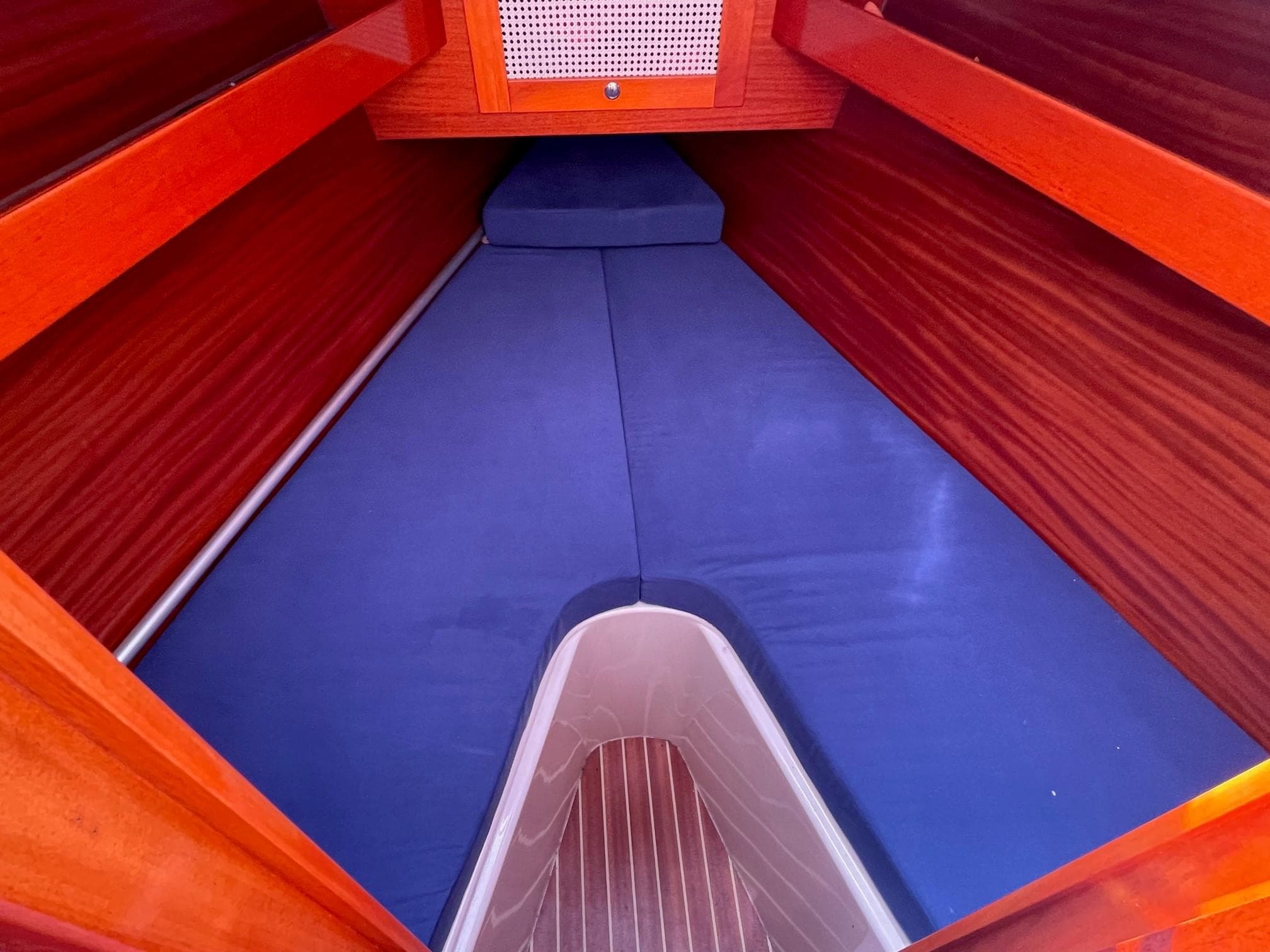 Interior of a 2004 Hanse 312 yacht with blue upholstery.