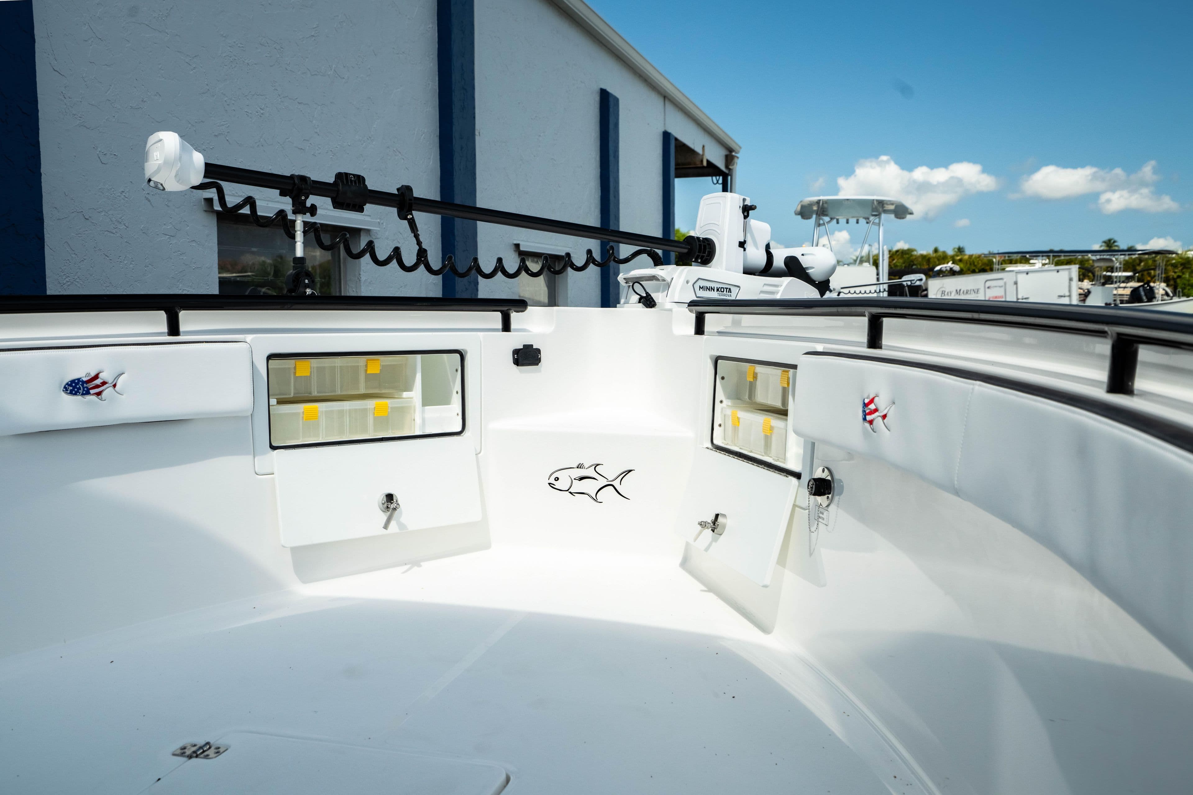 2025 Crevalle 26 HBW boat interior with storage compartments and fishing rod holders.
