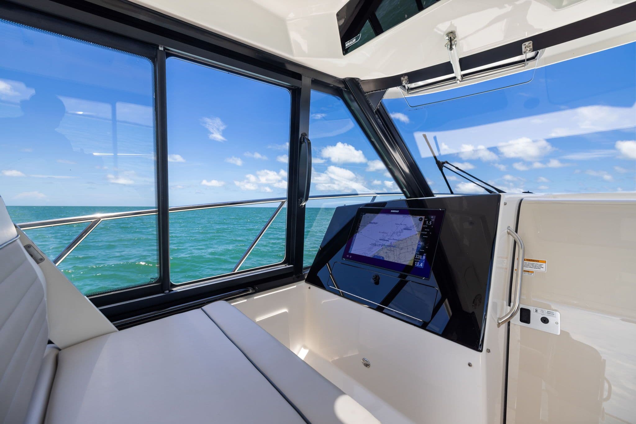 Interior view of 2025 Boston Whaler 365 Conquest with ocean view.