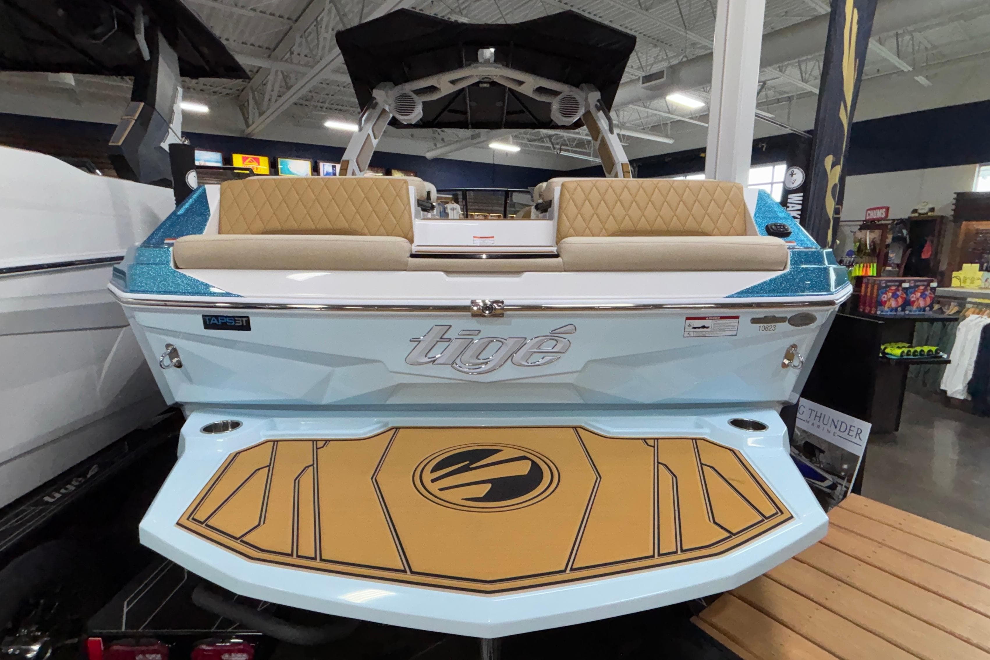 2026 Tigé Z3 boat with sleek design and luxurious seating in showroom.