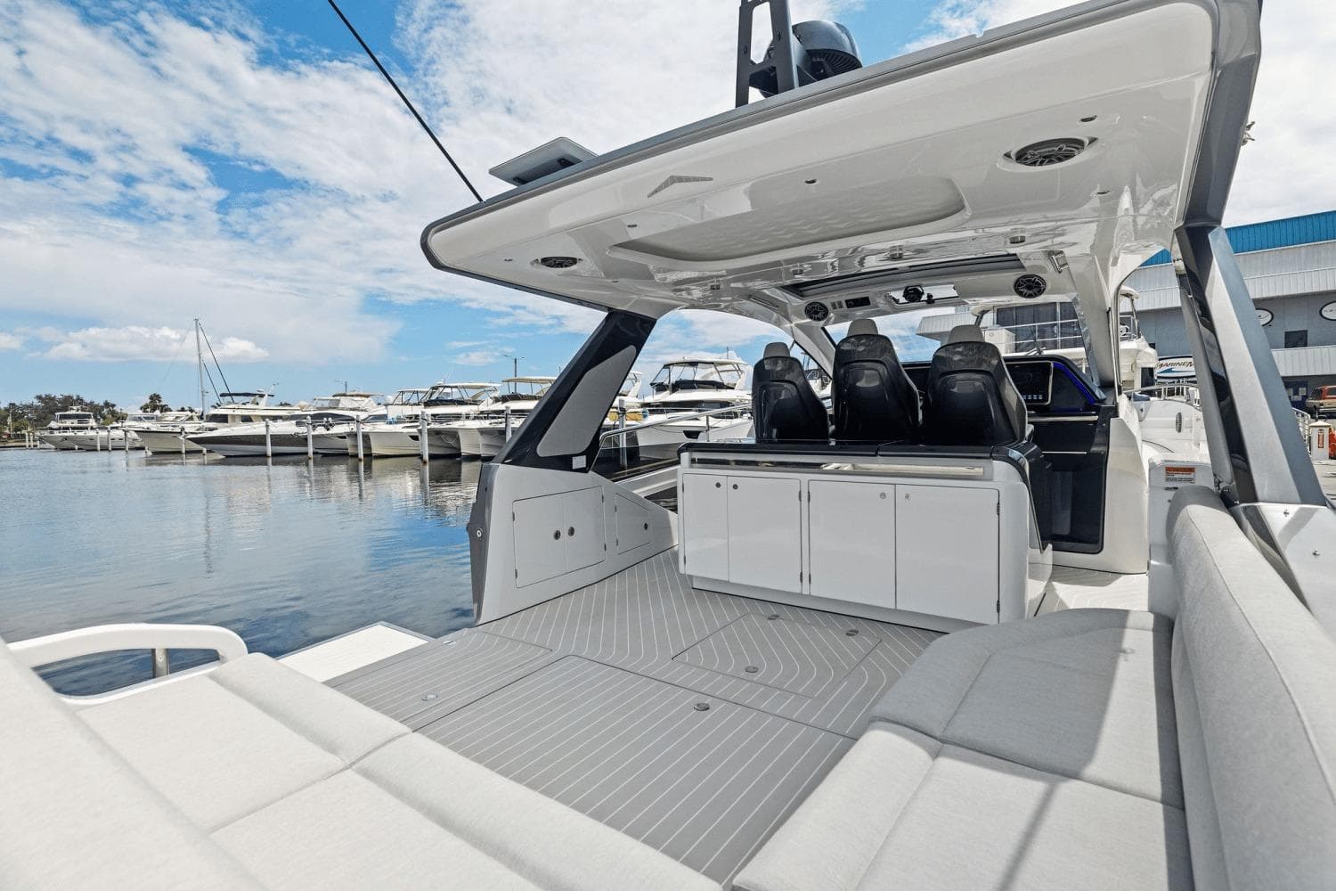 2026 Azimut Verve 48 luxury yacht interior with sleek seating and modern design at marina.