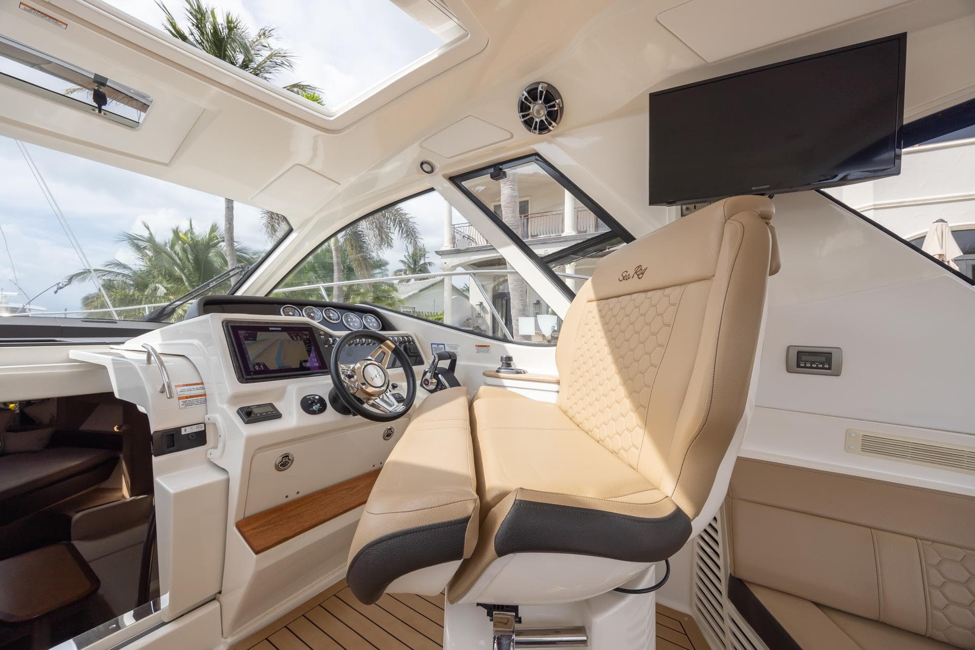 2019 Sea Ray Sundancer 350 Coupe helm with luxurious seating and modern controls.