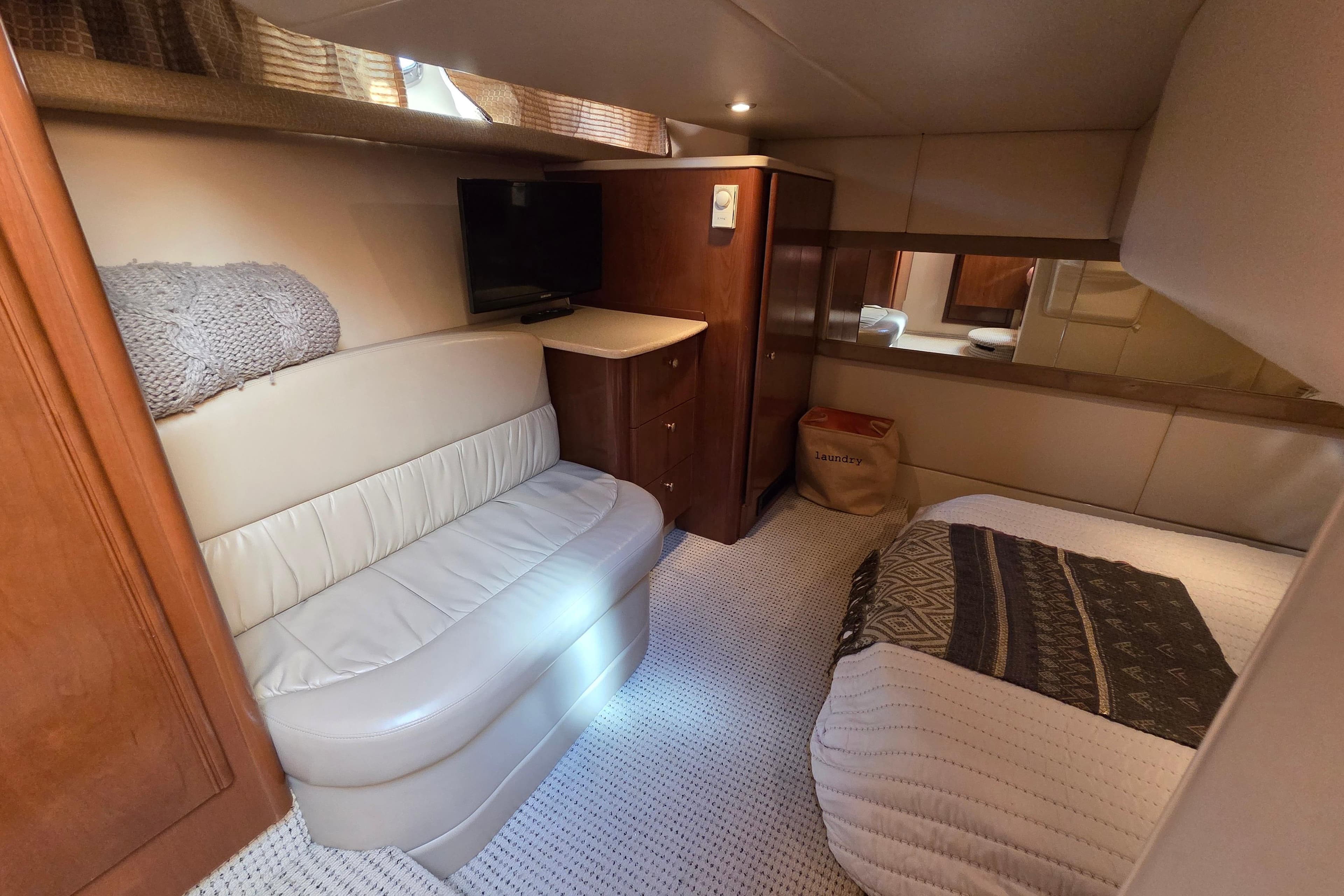 Luxurious interior of 2005 Meridian 411 Sedan yacht with cozy seating and elegant decor.