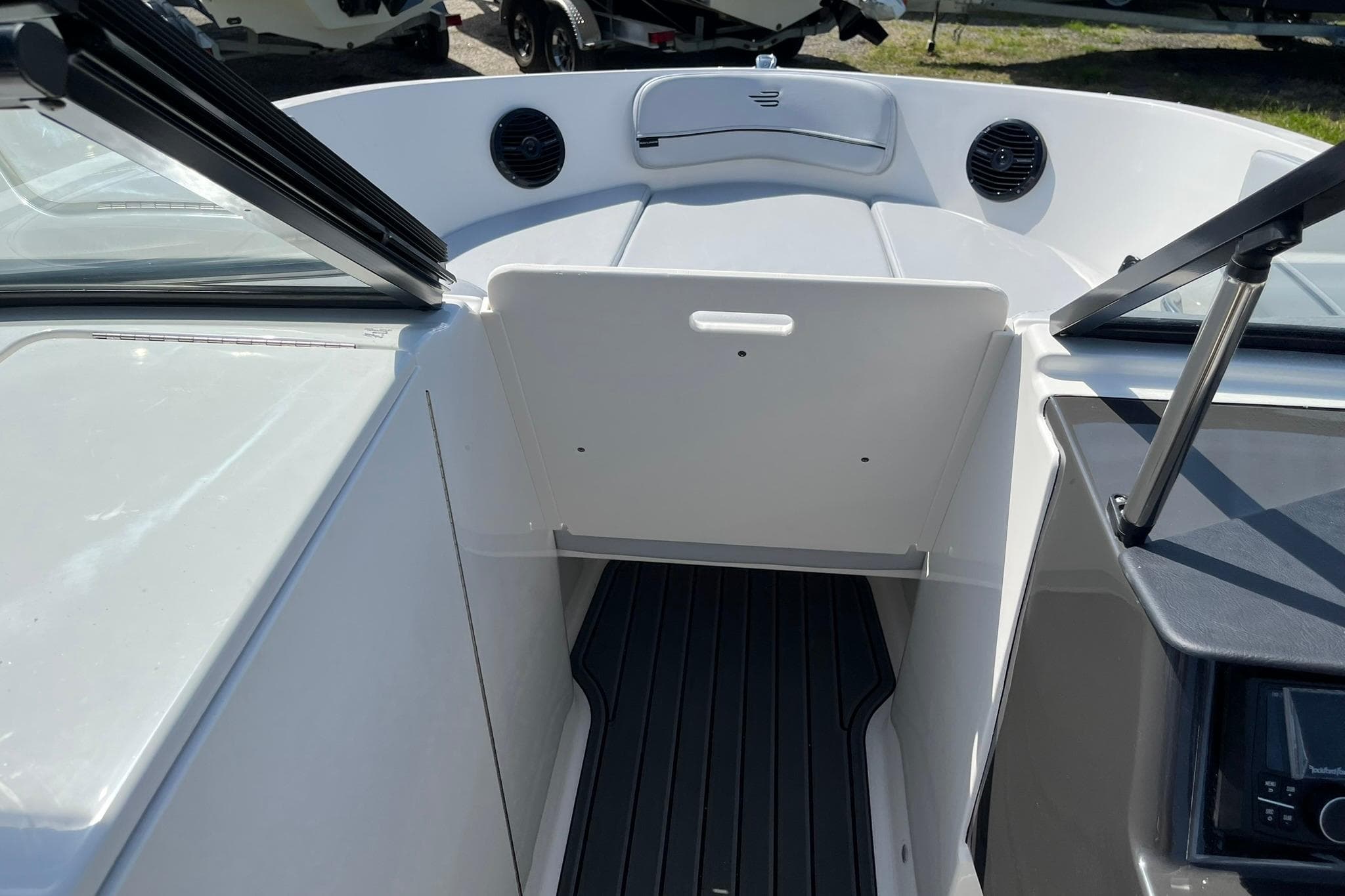2026 Bayliner VR6 Bowrider OB interior with open bow access and seating area.