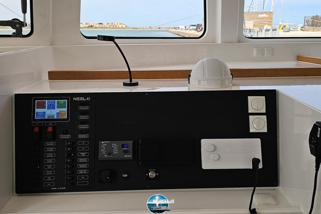 Control panel of 2023 NEEL 43 trimaran with navigation and communication equipment.