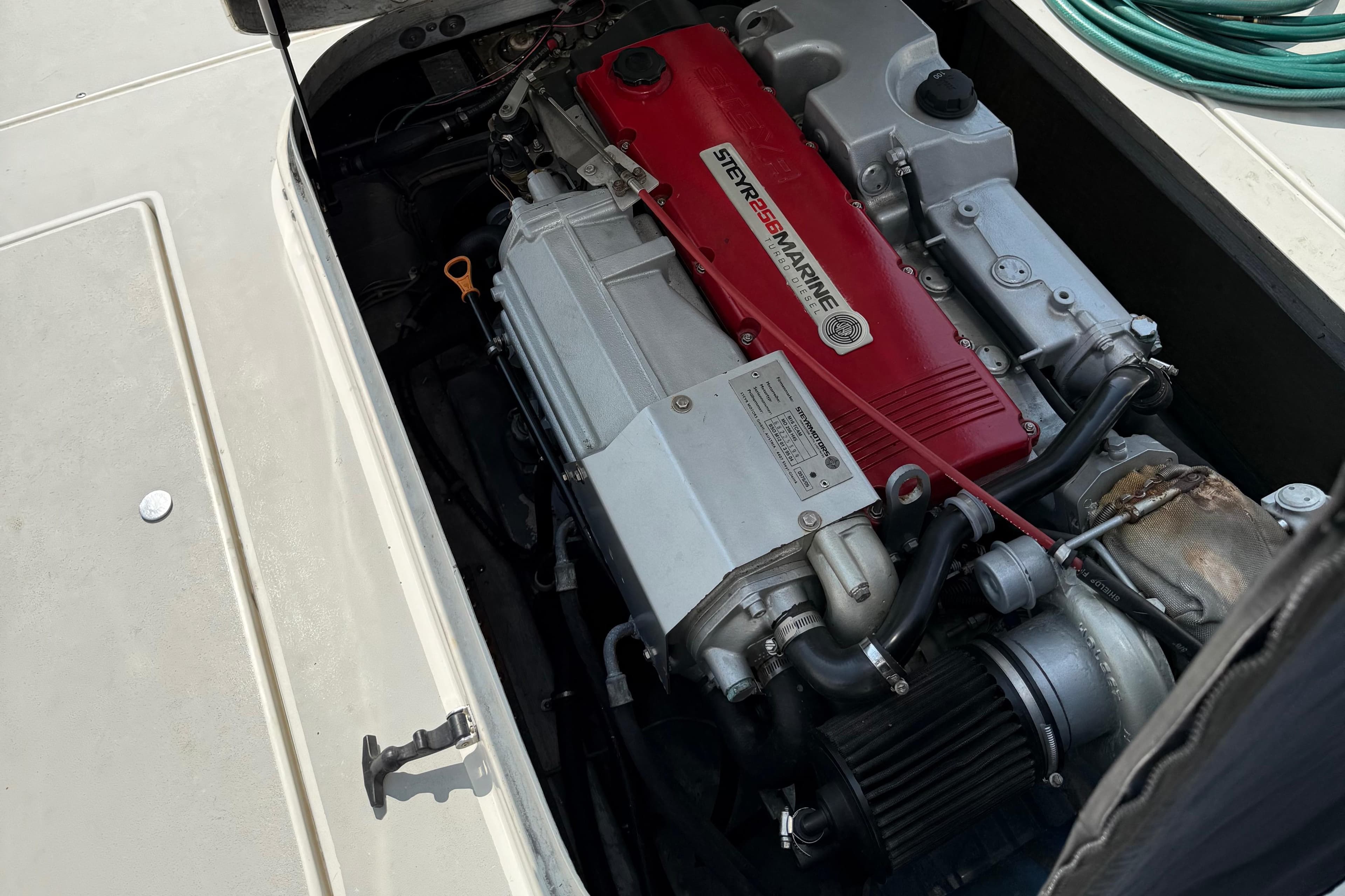 Engine compartment of a 1994 Albin 28 Tournament Express boat, featuring a Steyr Marine engine.