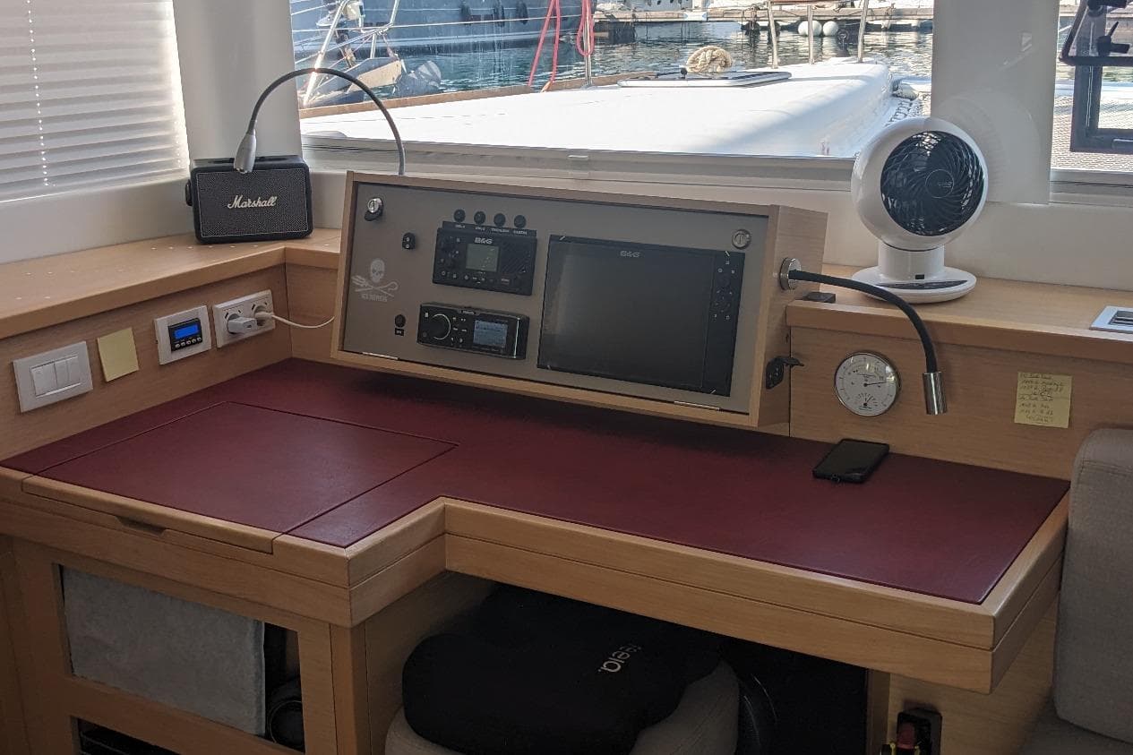 Navigation station on a 2020 Lagoon 450F catamaran with control panel and equipment.