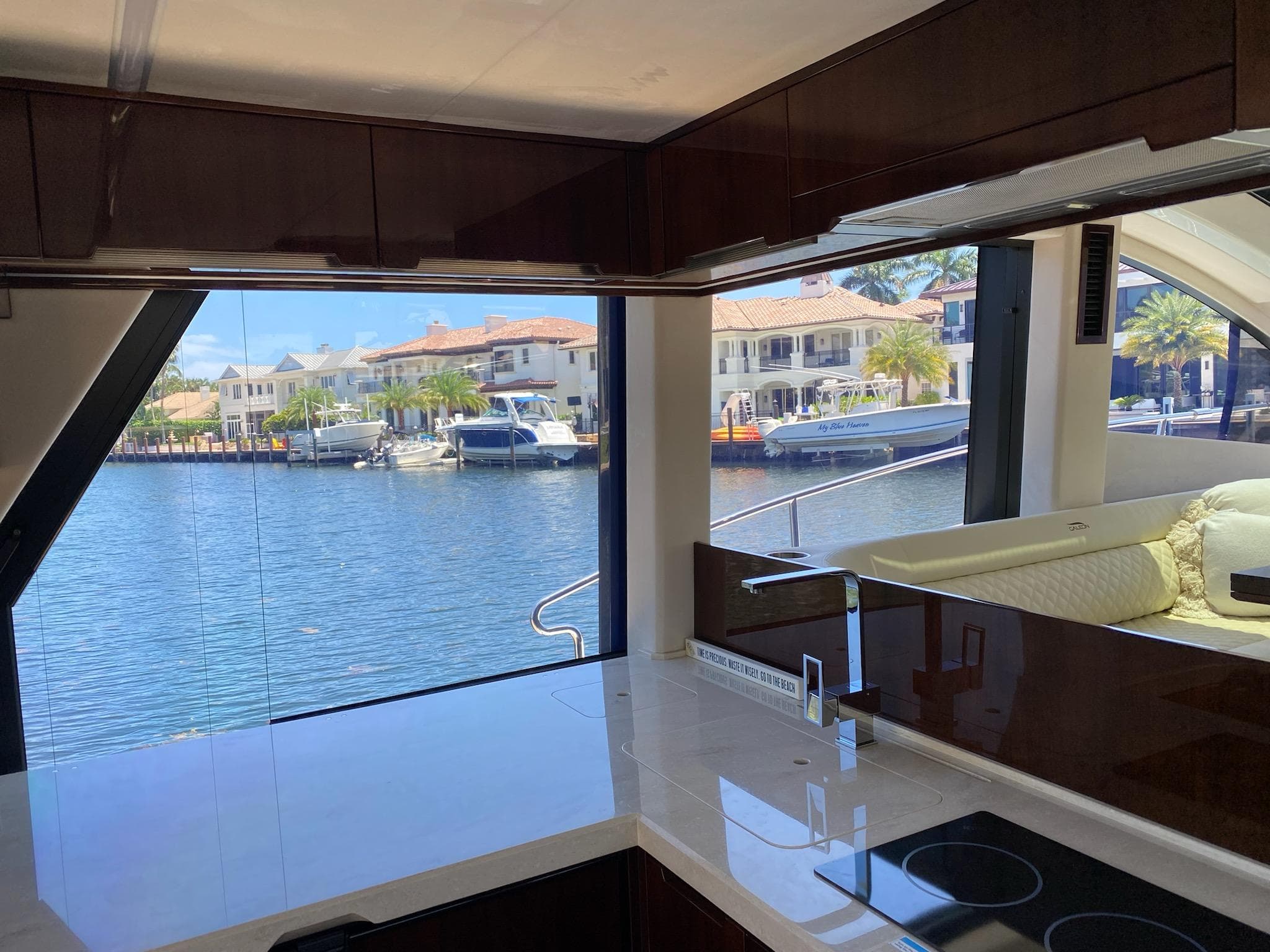 Interior view of 2022 Galeon 470 Skydeck yacht with waterfront scenery.