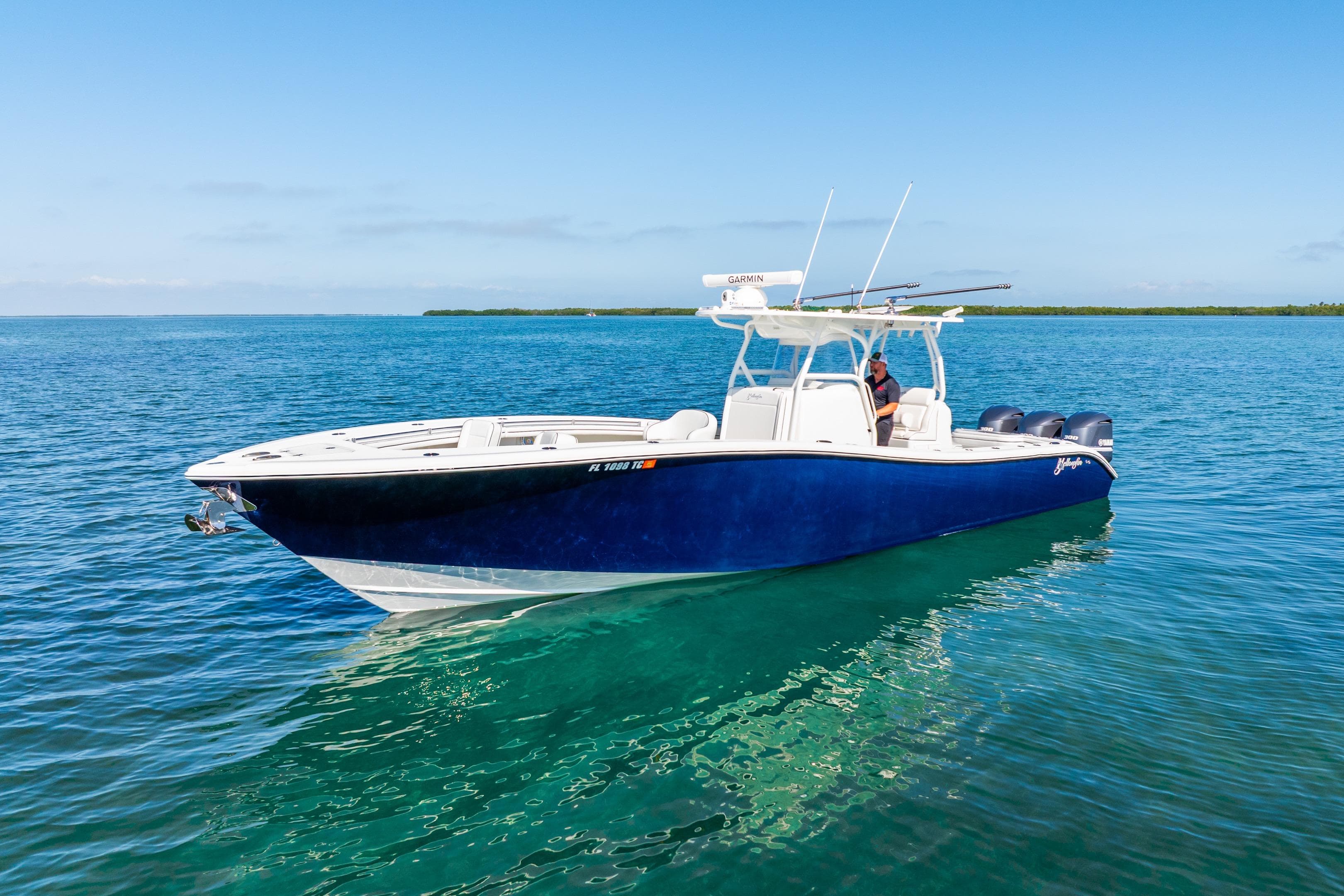 2016 Yellowfin 36 Offshore boat on clear blue water, sunny day.