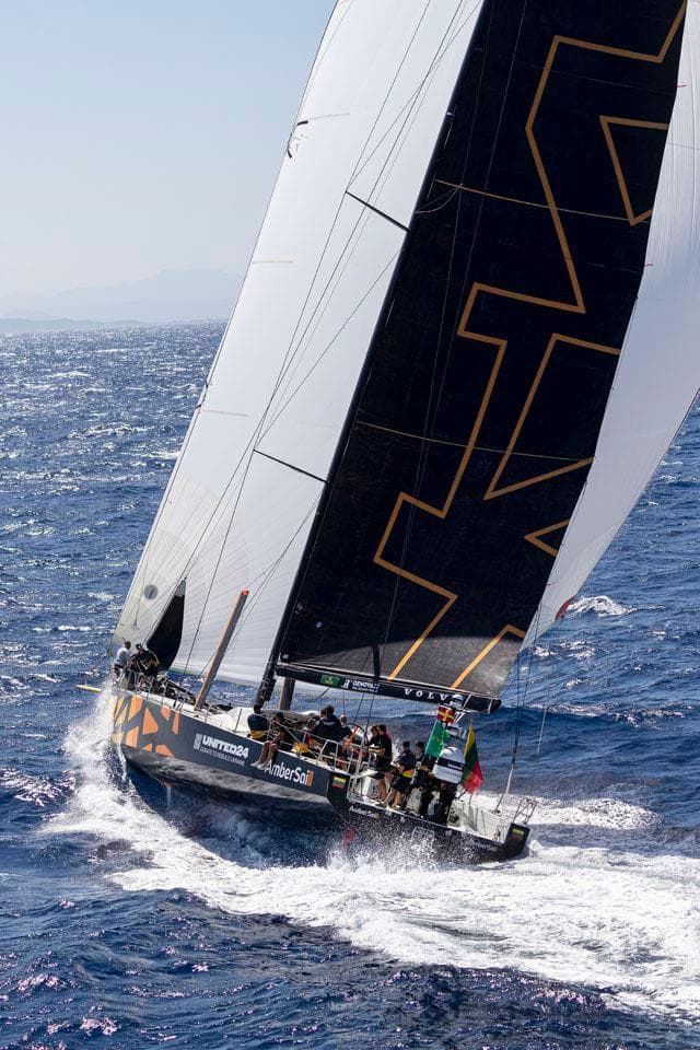 Sailing yacht Volvo Ocean 65 navigating ocean waves, 2013 model.
