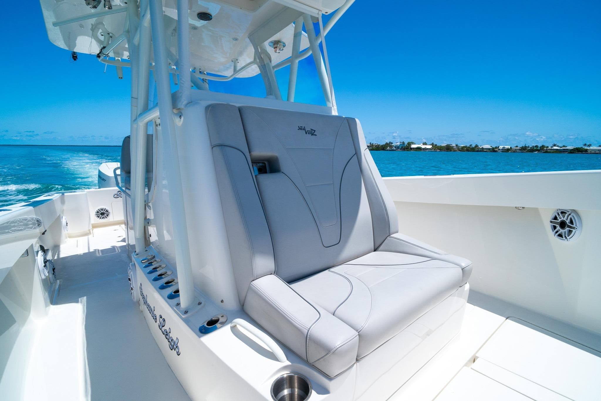 2025 SeaVee 322Z boat interior with sleek seating, cruising on clear blue waters.