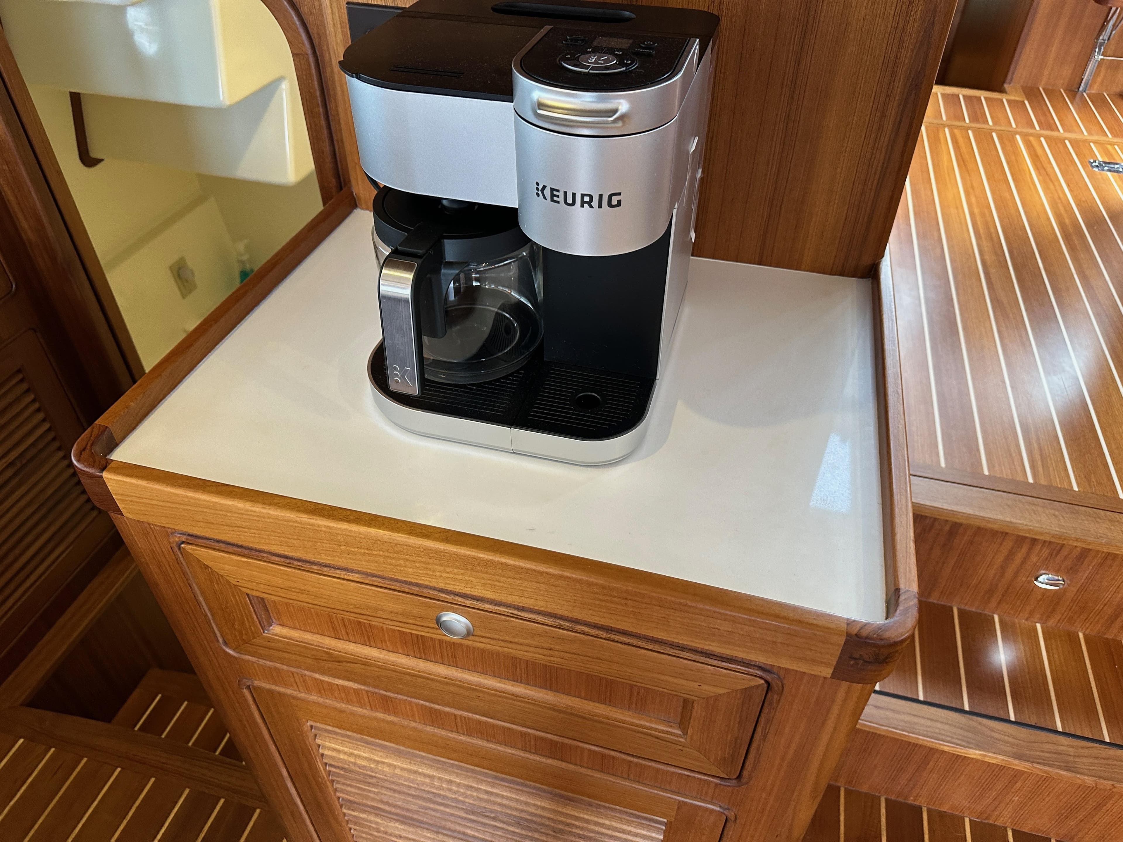 Keurig coffee maker on Helmsman Trawlers 43E PILOTHOUSE, 2023 model, wooden interior.