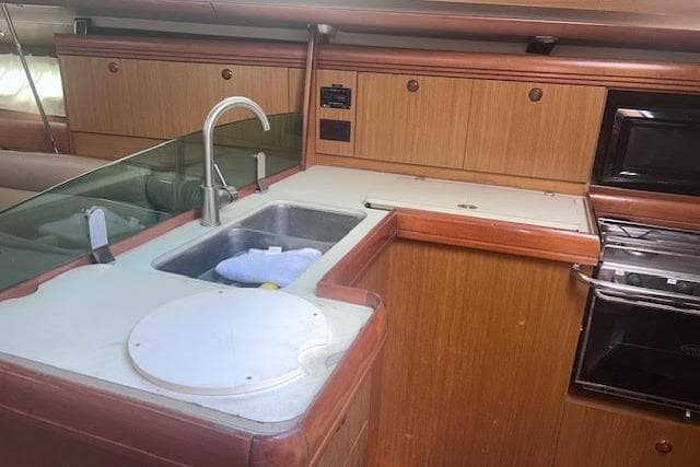 Interior view of 2007 Jeanneau Sun Odyssey 42 DS yacht kitchen area.