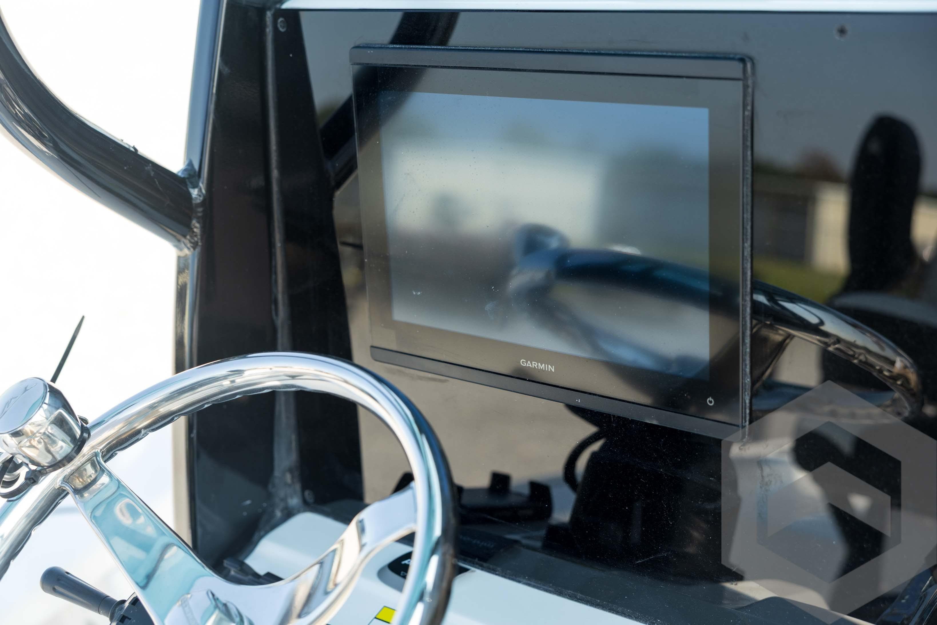 Steering console of 2026 Tidewater 2410 Bay Max with Garmin display.
