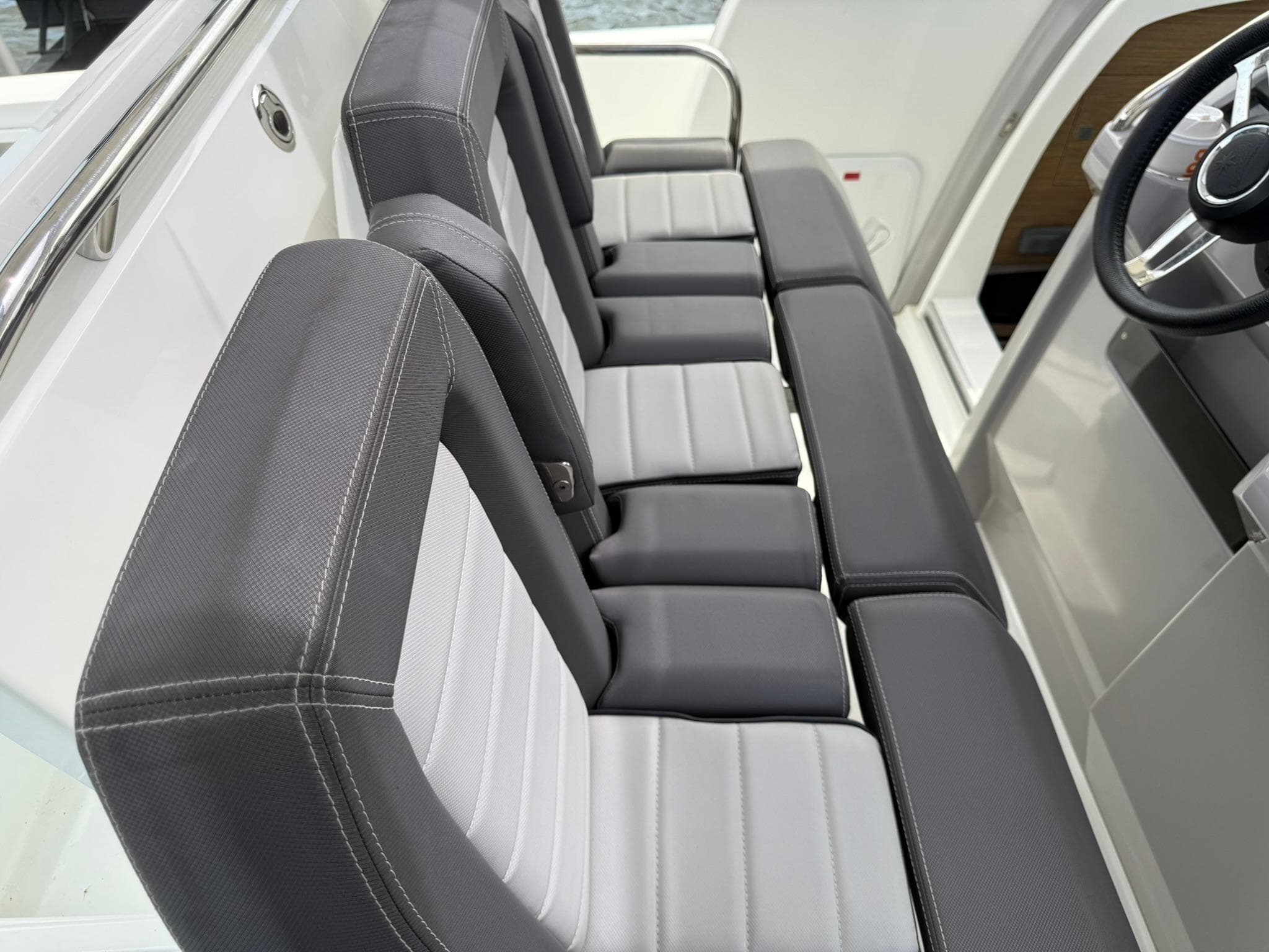 2018 Jeanneau Leader 10.5 boat interior with sleek, modern seating design.