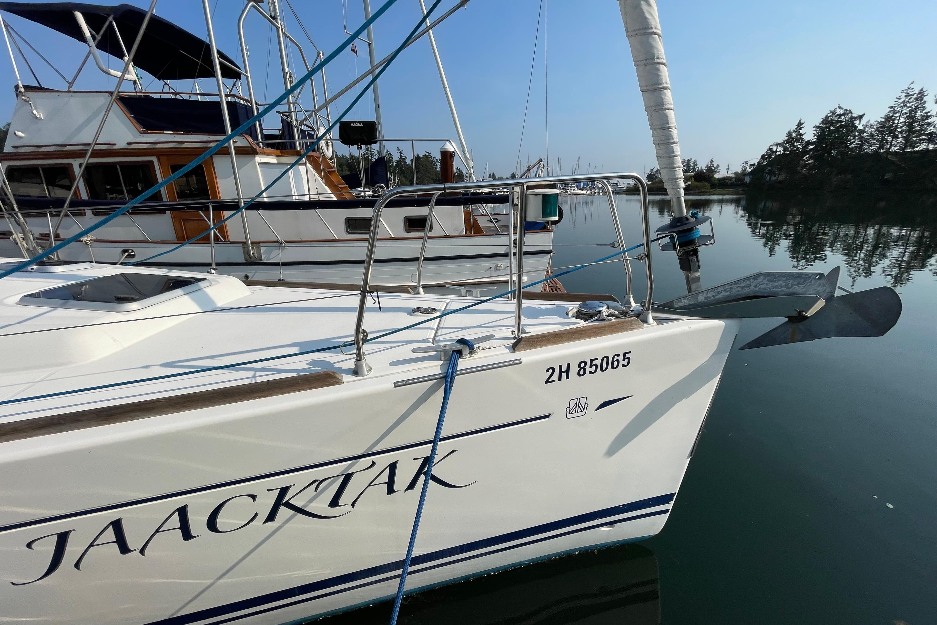 Sailboat Dufour 40 Performance 2004 docked in calm marina waters.