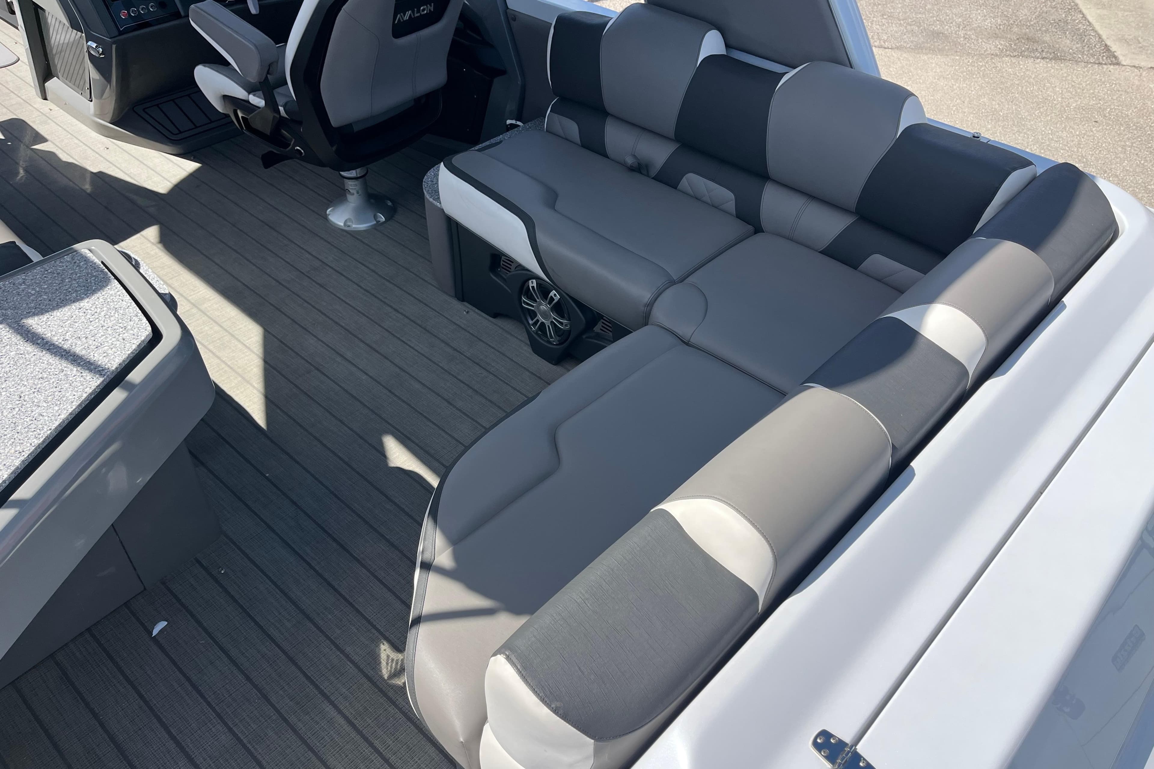 Luxurious seating on 2026 Avalon 2785 Excalibur Carbon Series boat with modern interior design.