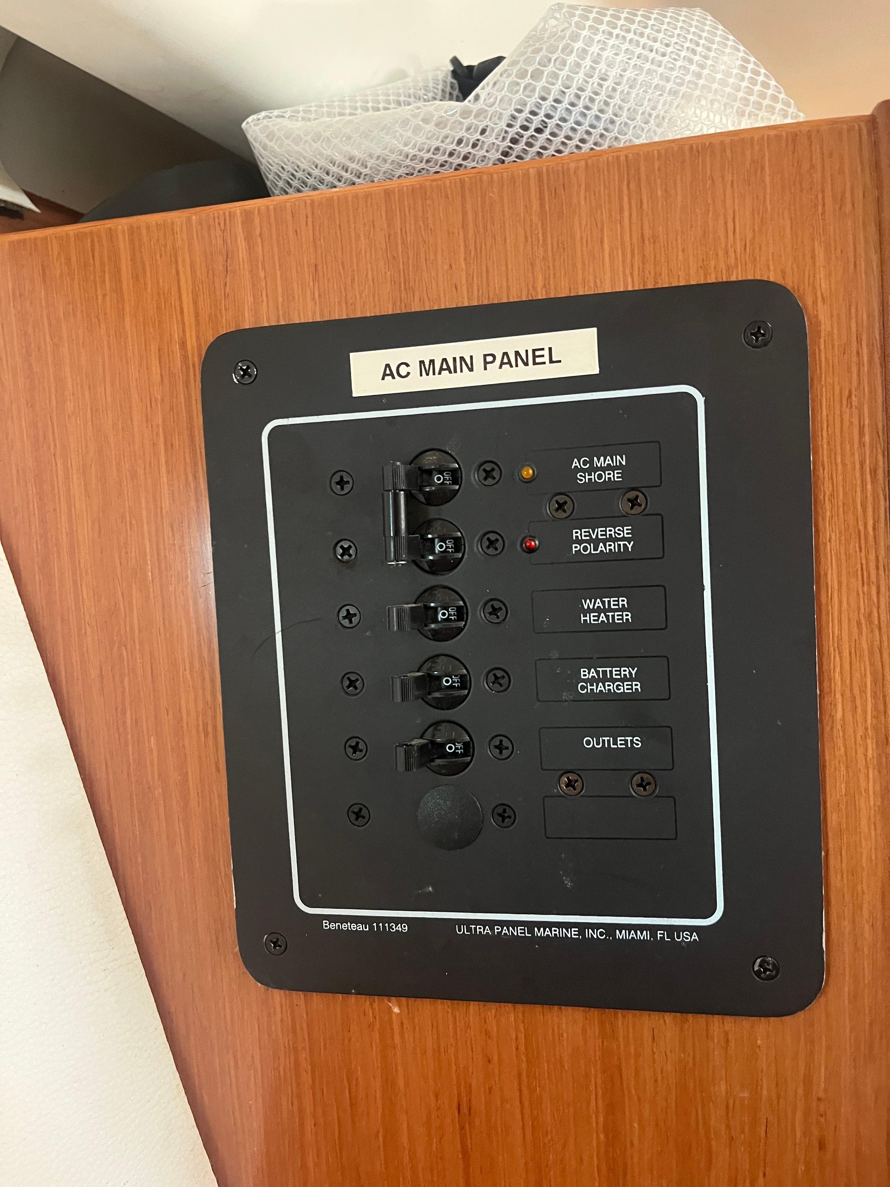 AC main panel on 2007 Beneteau Oceanis Clipper 343 yacht, featuring multiple switches.