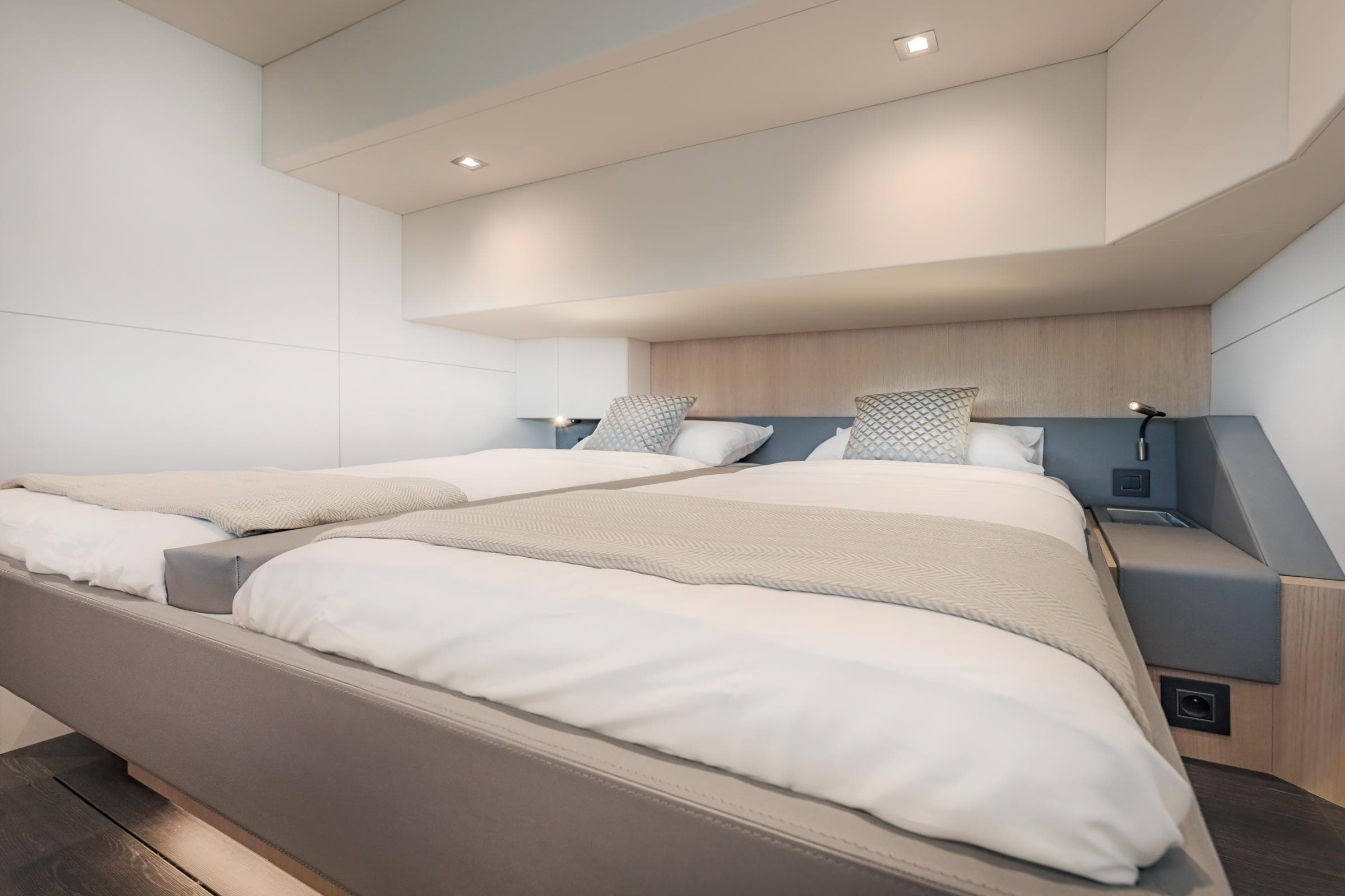 Luxurious bedroom interior of 2025 Privilege Signature 650 yacht with modern design.