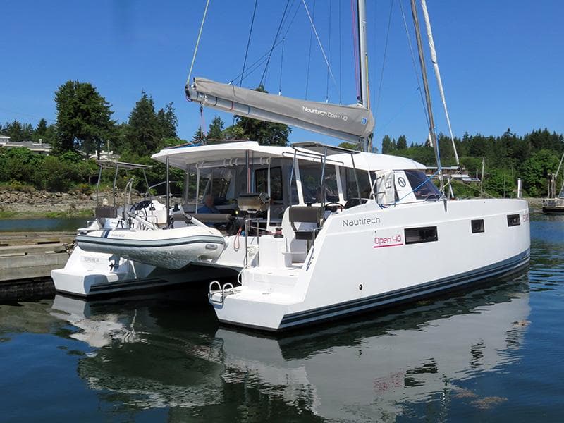 2016 Nautitech 40 Open catamaran docked in a serene marina.