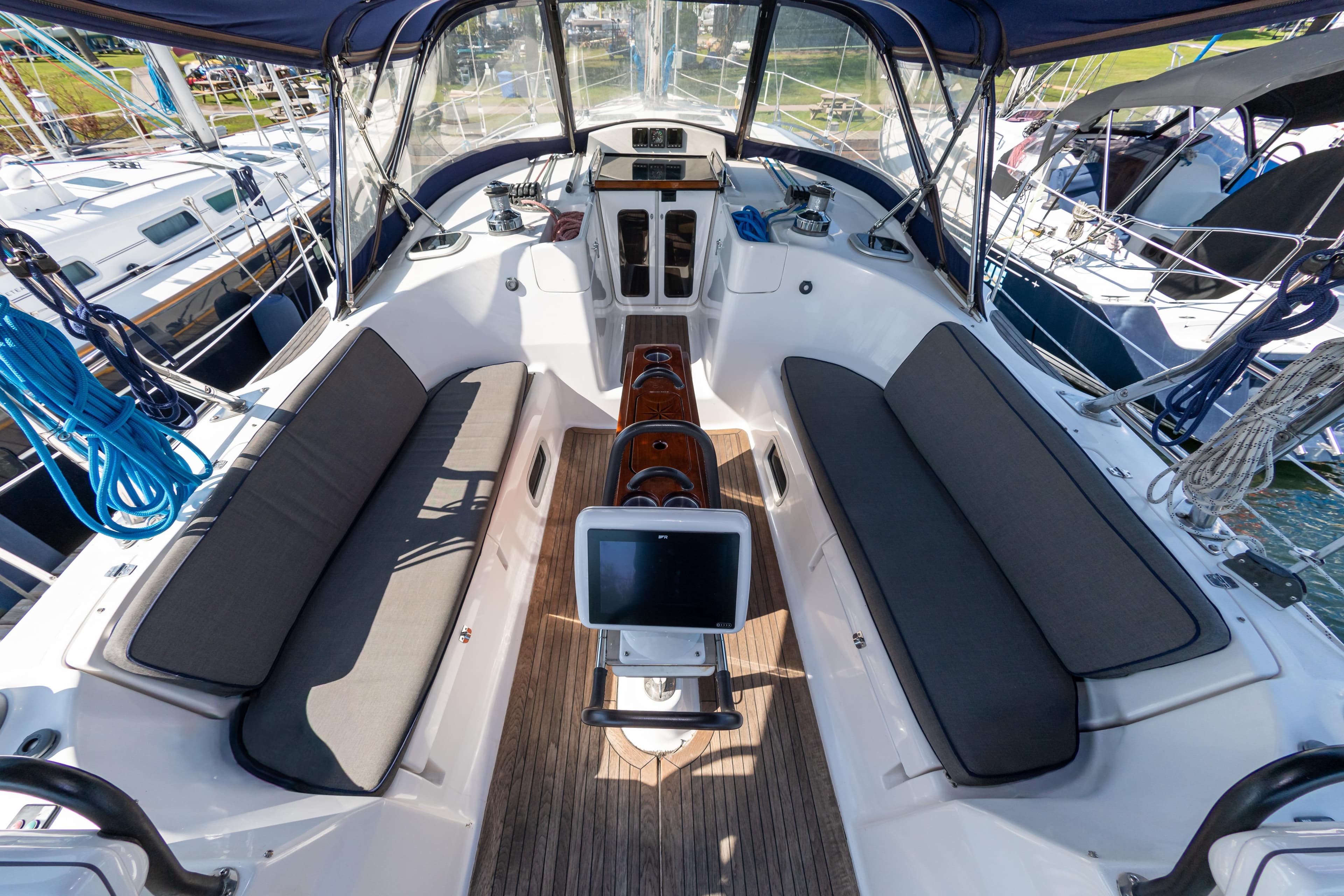 Cockpit of 2007 Hunter 49 sailboat with seating and navigation equipment.