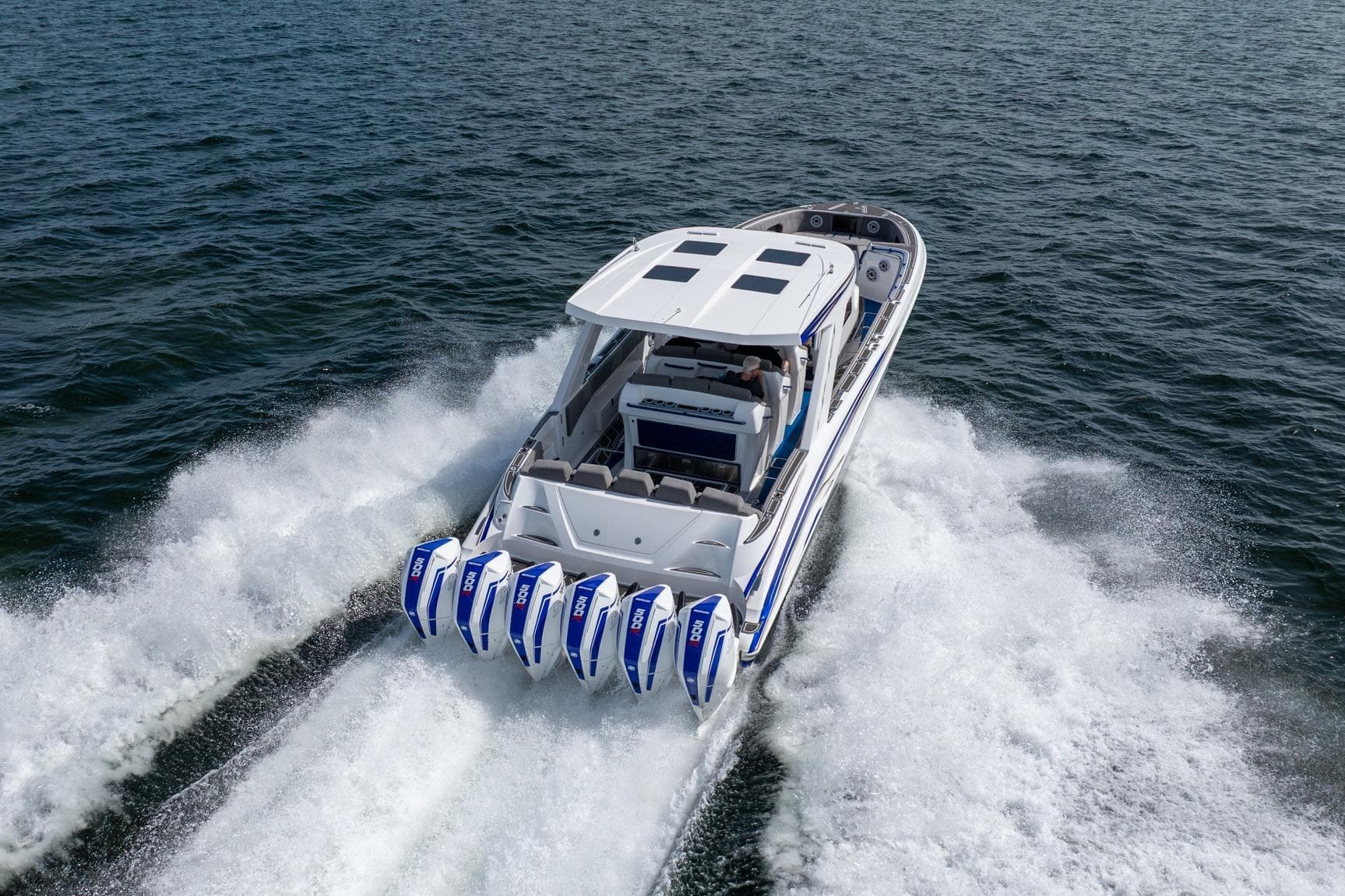 Deep Impact 449 Sport 2027 boat cruising on open water with powerful engines.