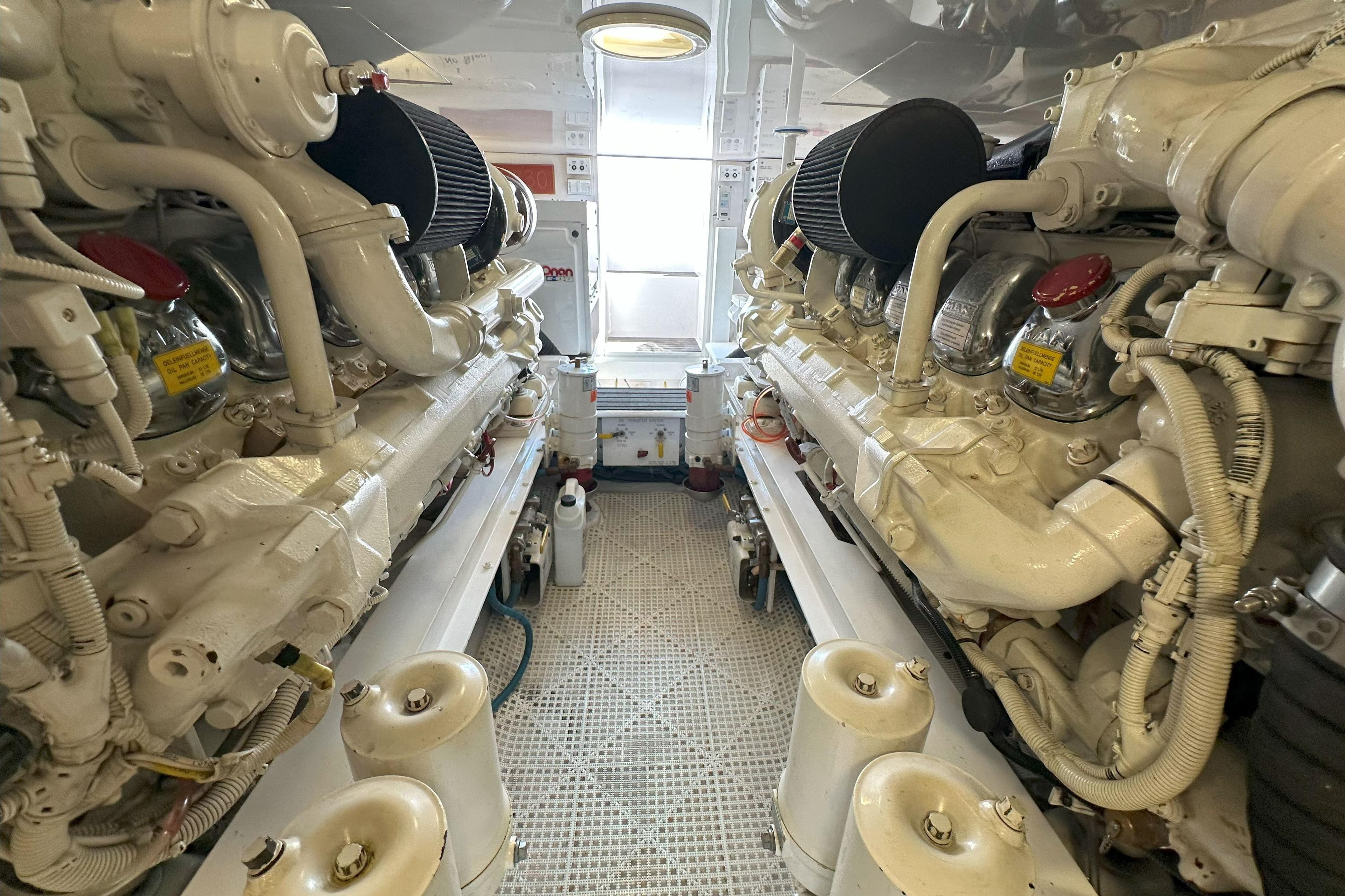 Engine room of 2003 Viking 48 Convertible yacht, showcasing dual powerful engines.