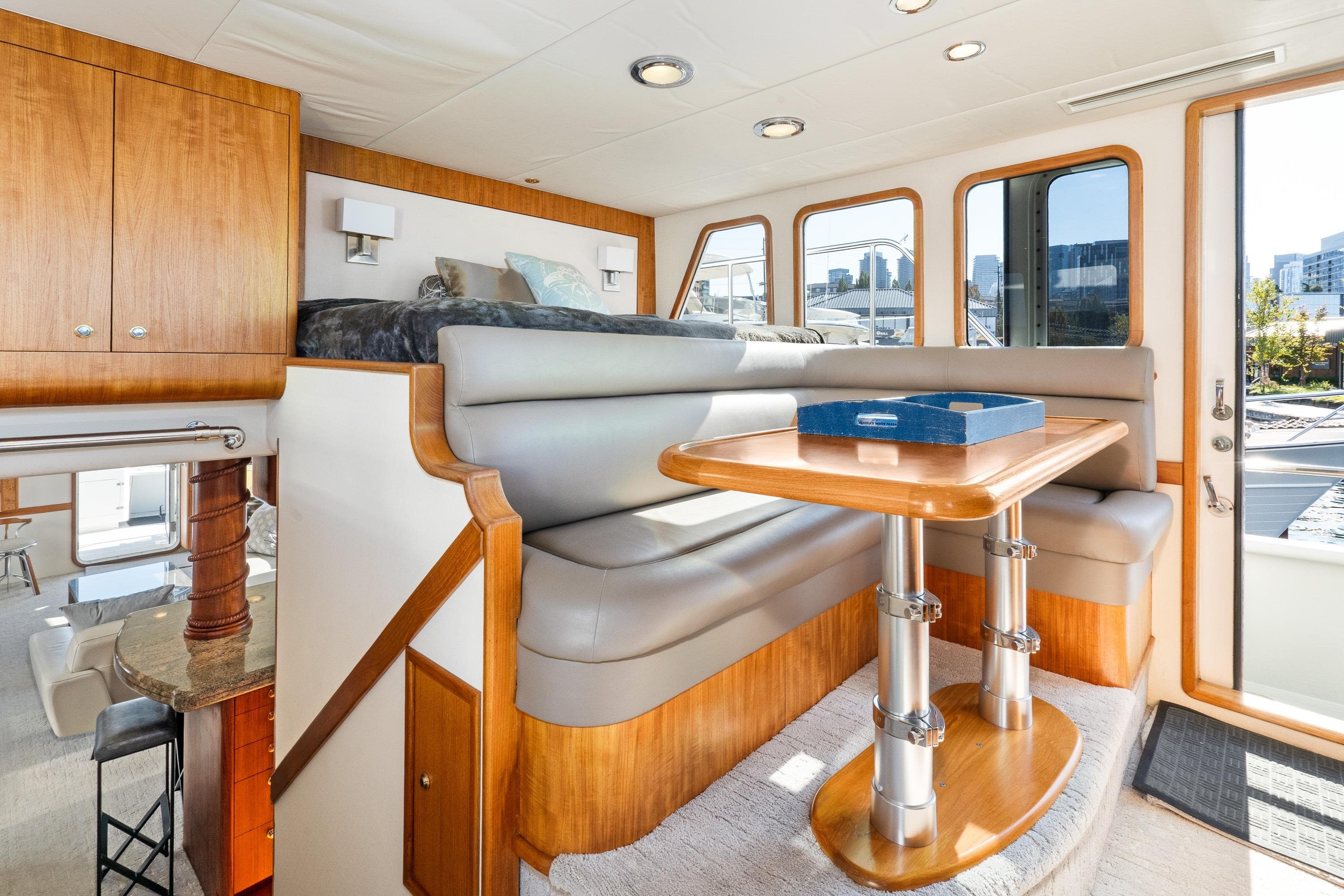 Luxurious interior of a 1998 Northern Marine Trawler with dining area and modern furnishings.