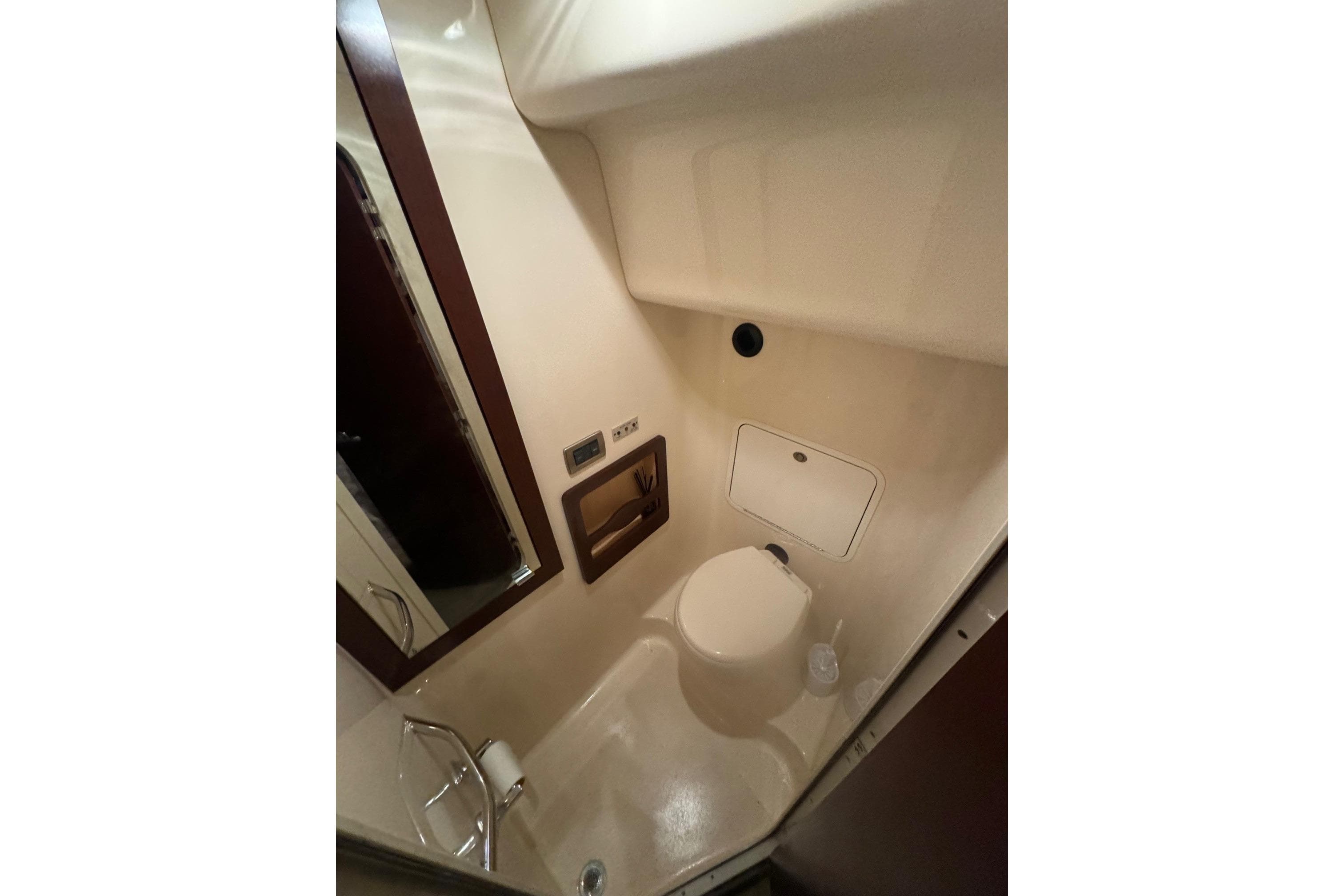Bathroom interior of 2007 Sea Ray 40 Motor Yacht, featuring compact design and amenities.