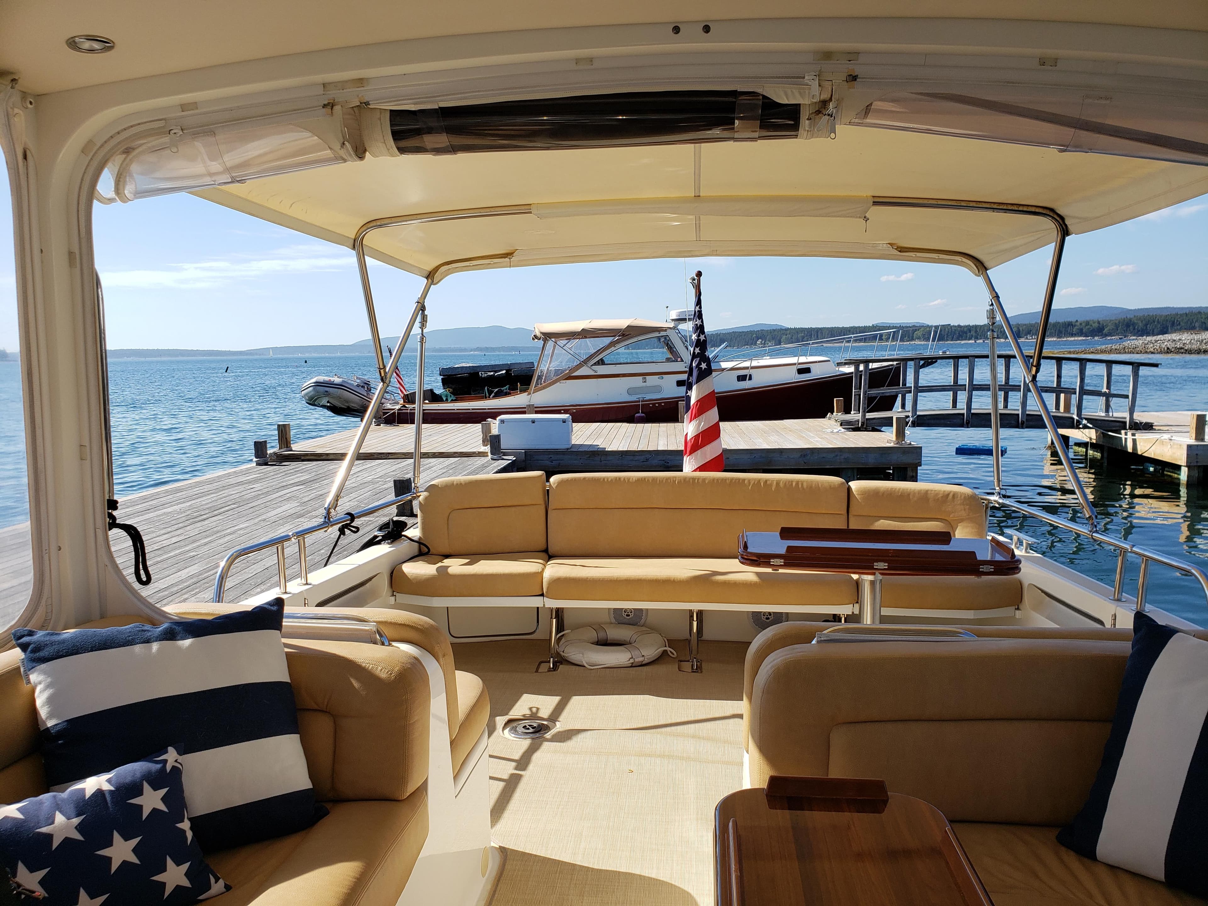 Interior view of 2013 MJM 40z Downeast yacht with dock and ocean backdrop.