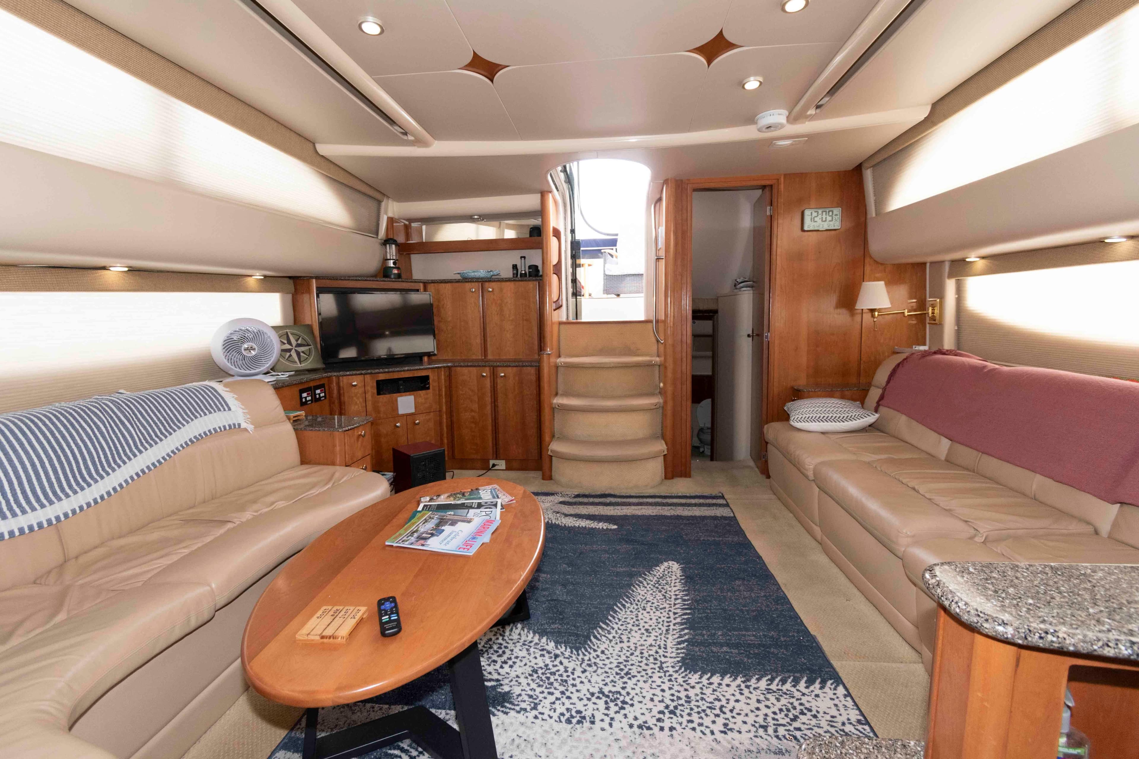 Luxurious interior of a 2004 Meridian 408 Motoryacht with plush seating and modern amenities.