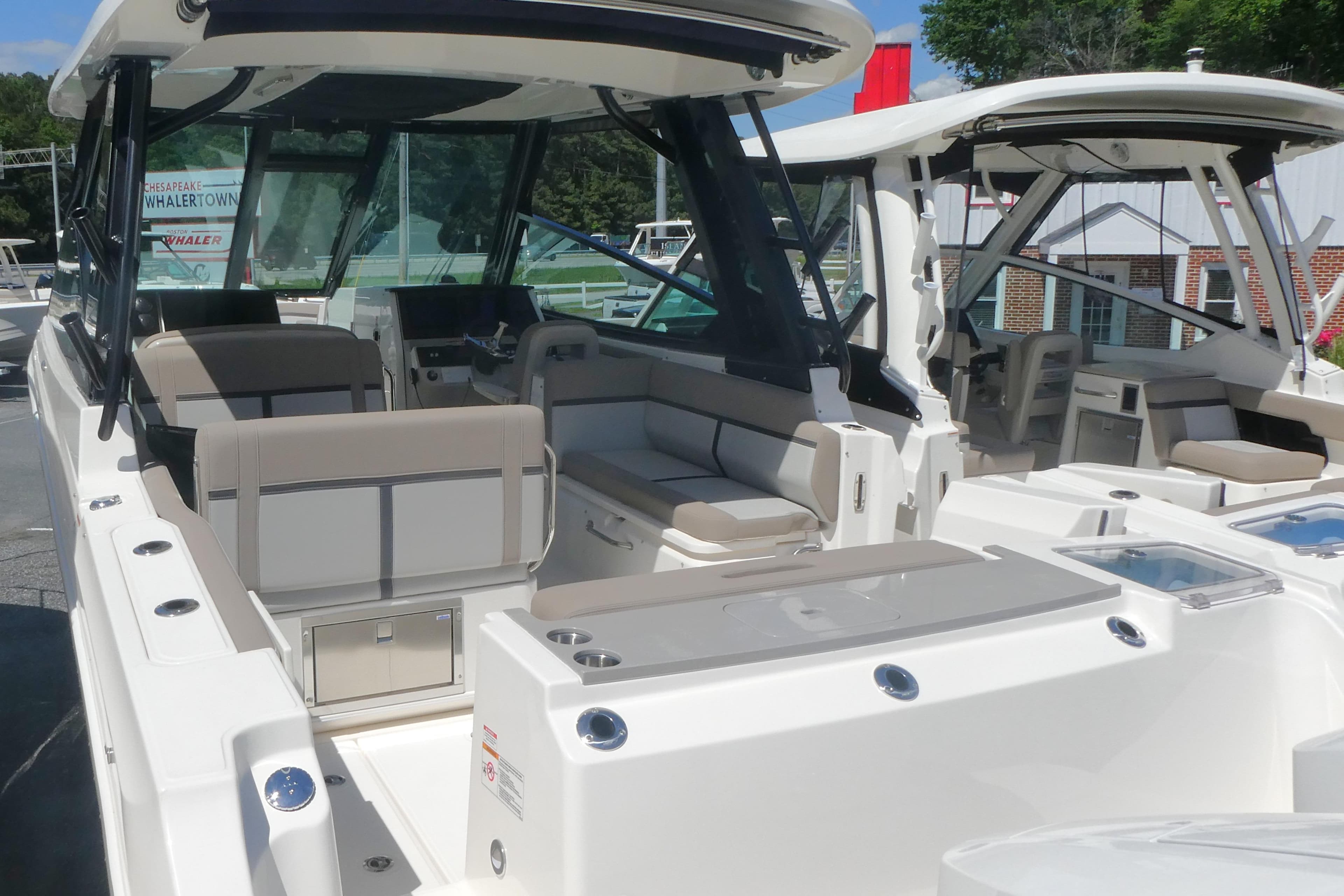 2026 Boston Whaler 330 Vantage boat interior with seating and helm station.