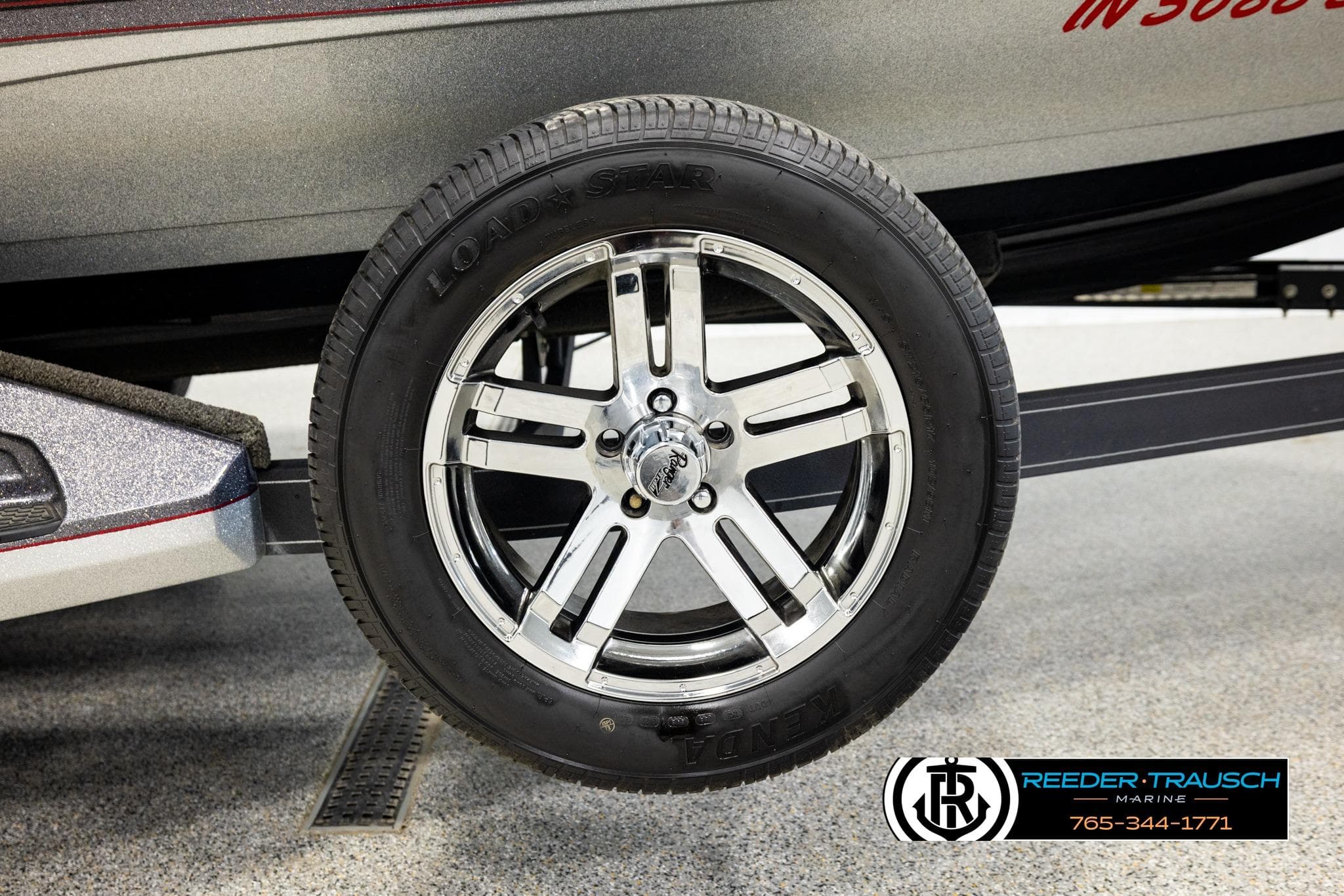 2023 Ranger Z519 boat trailer wheel with chrome rim and Load Star tire.